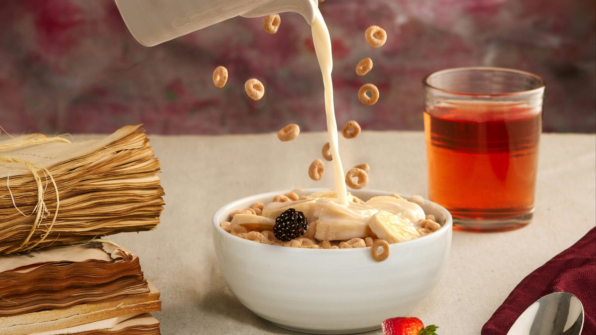 a bowl of oatmeal is being poured into a bowl