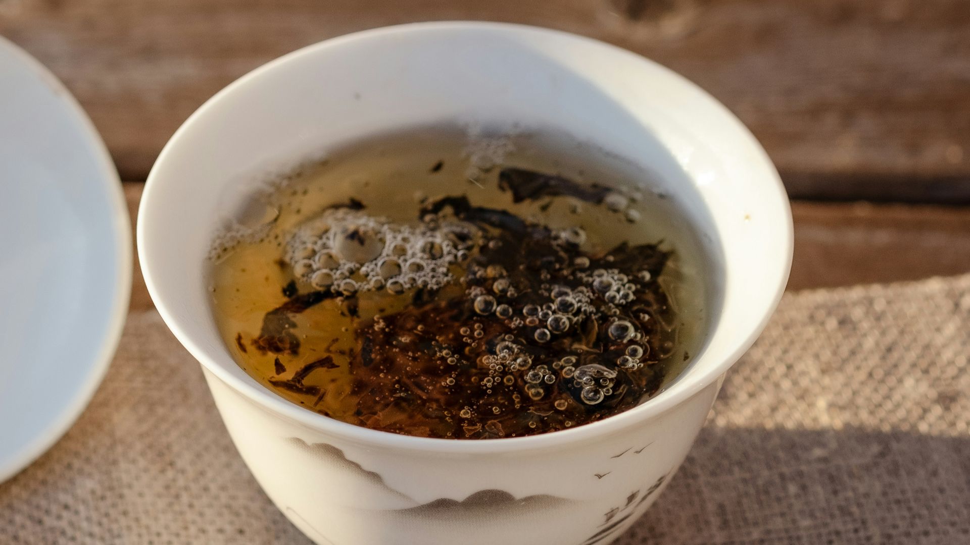 a cup of tea is sitting on a table