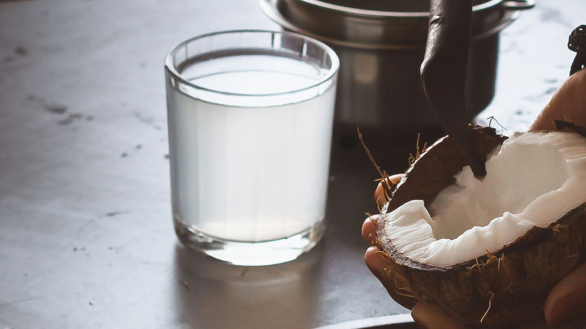 person holding white ceramic mug with coffee