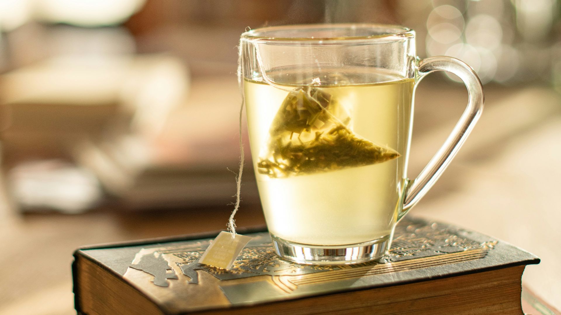 clear glass mug on brown wooden table