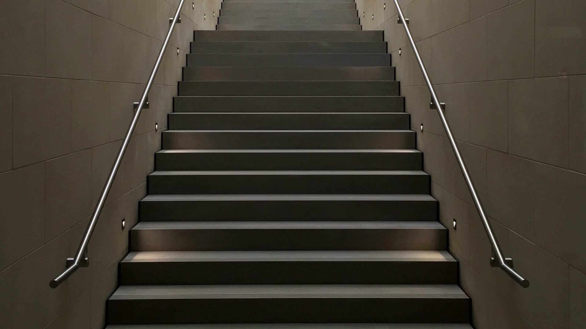 gray concrete stair with gray steel handle