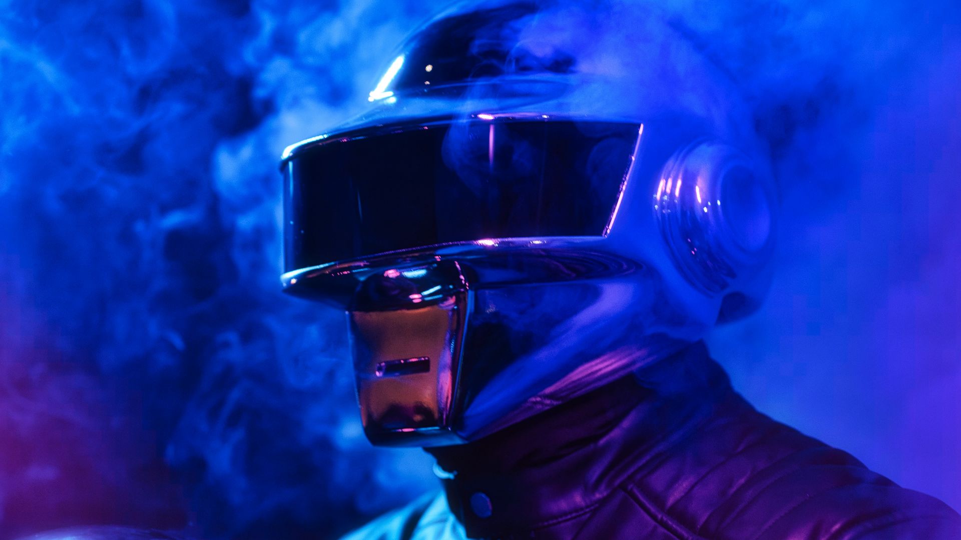 man in black leather jacket wearing black helmet