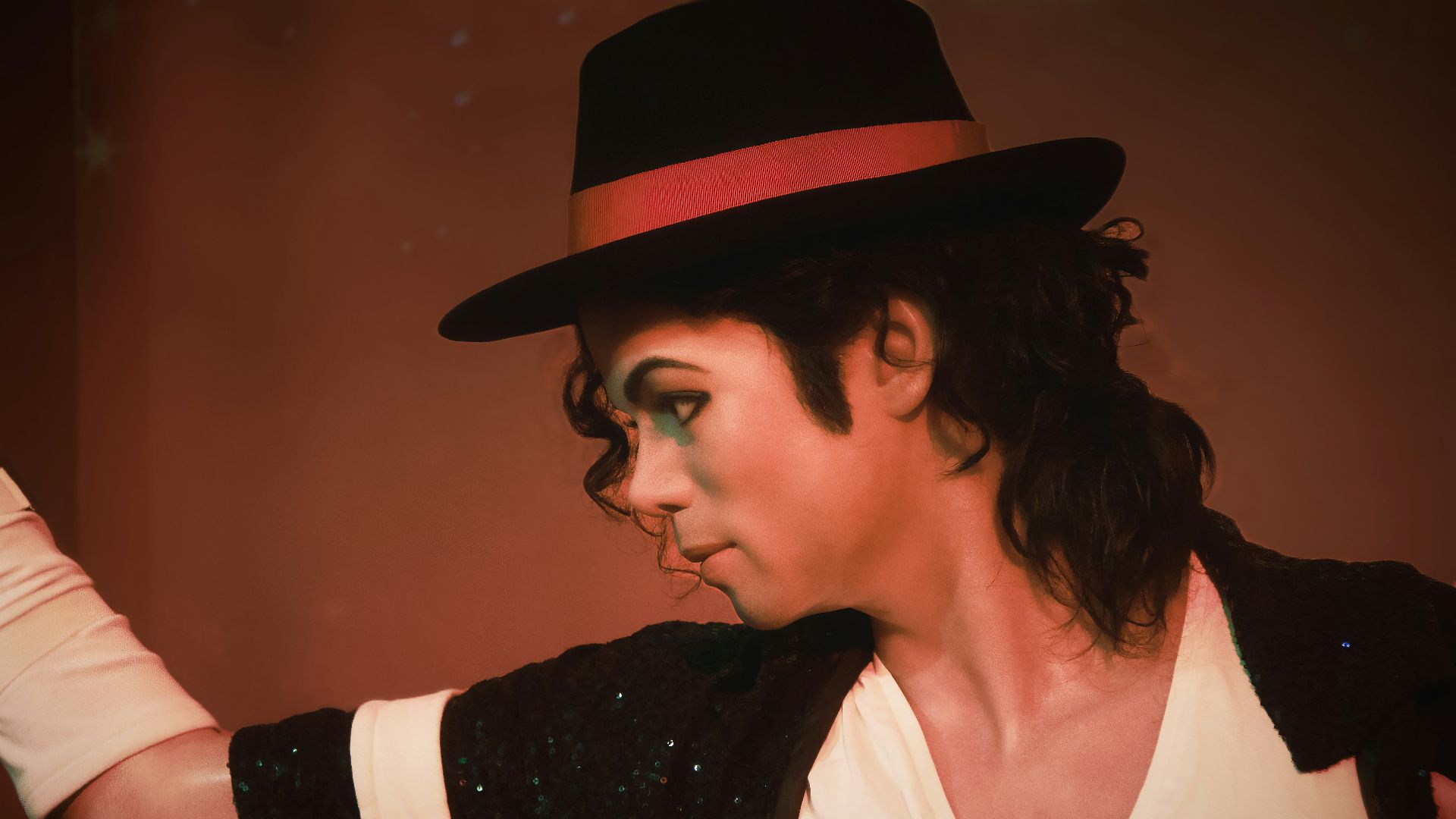 a man in a top hat and black jacket