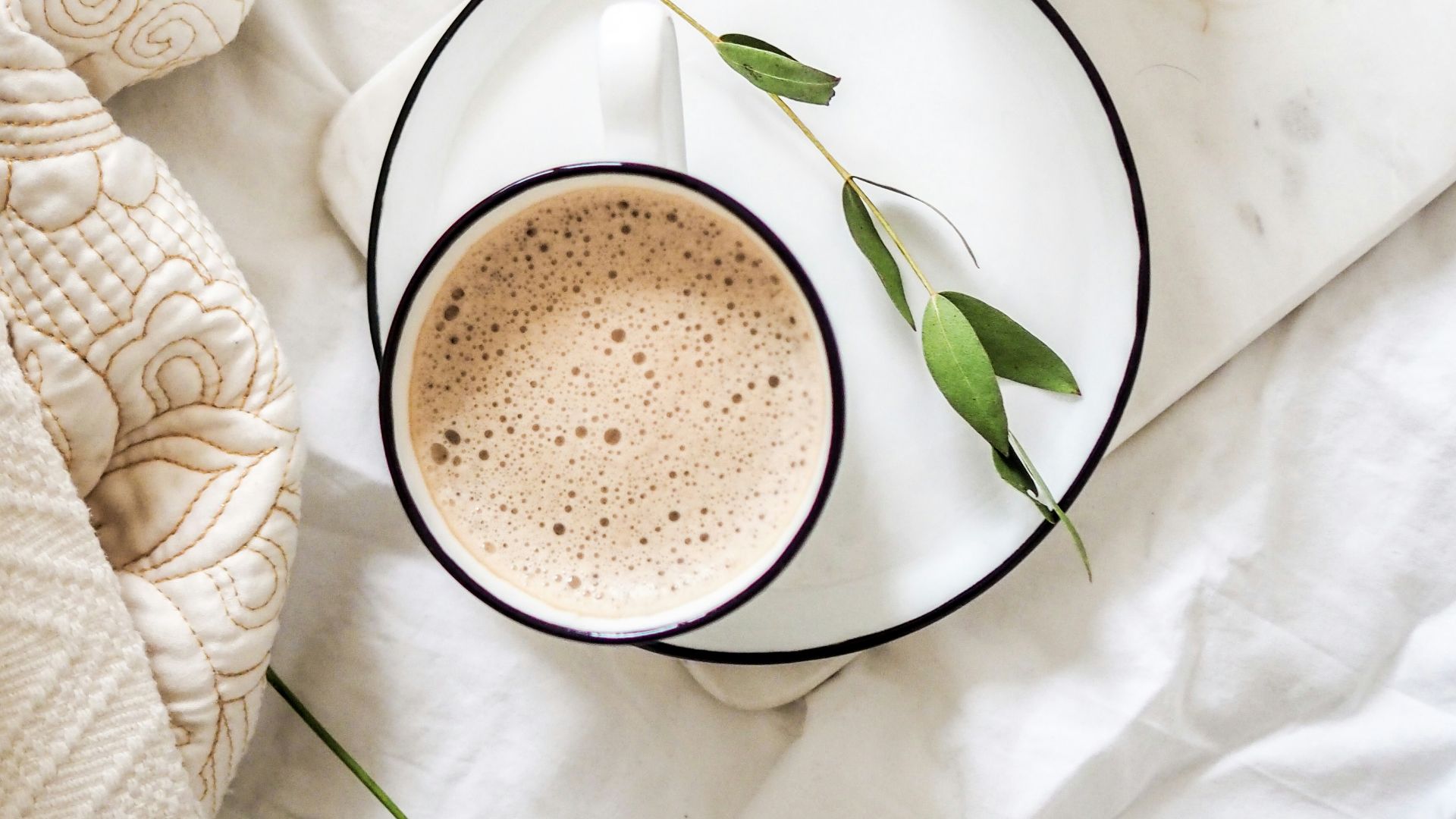 white teacup filled with coffee