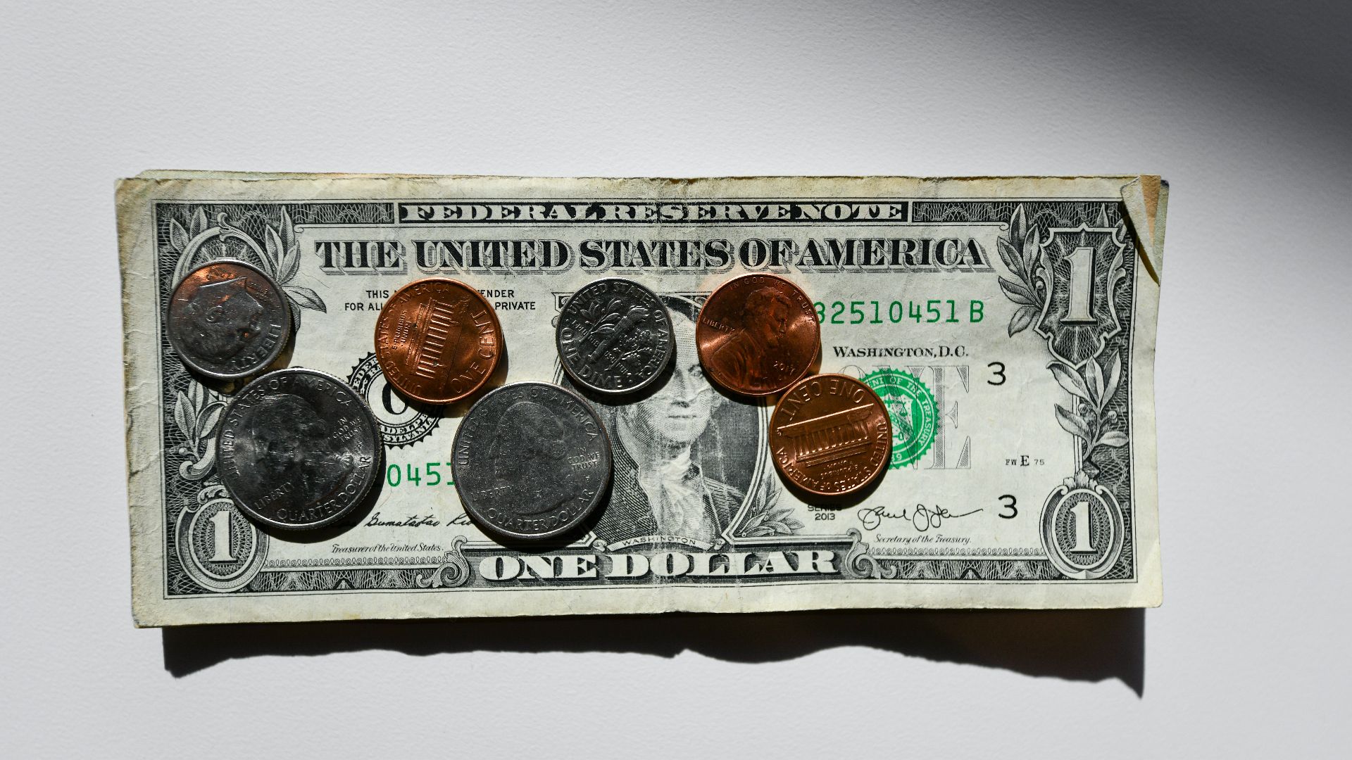 silver and gold round coins in box
