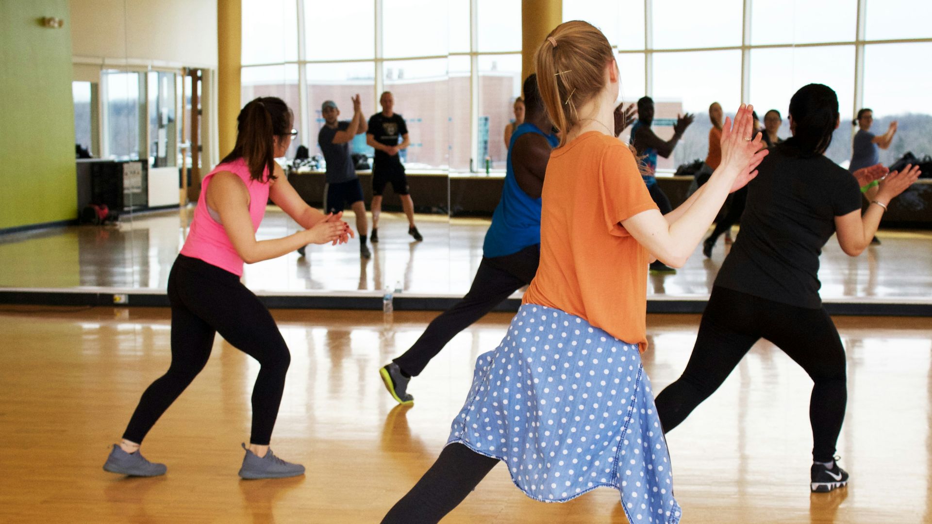 women dancing near mirror