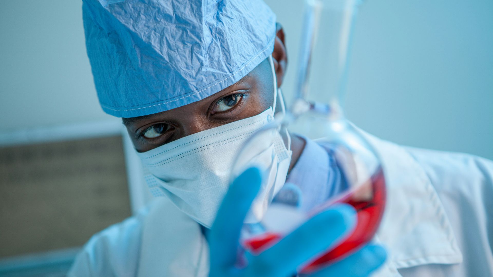 person in white face mask
