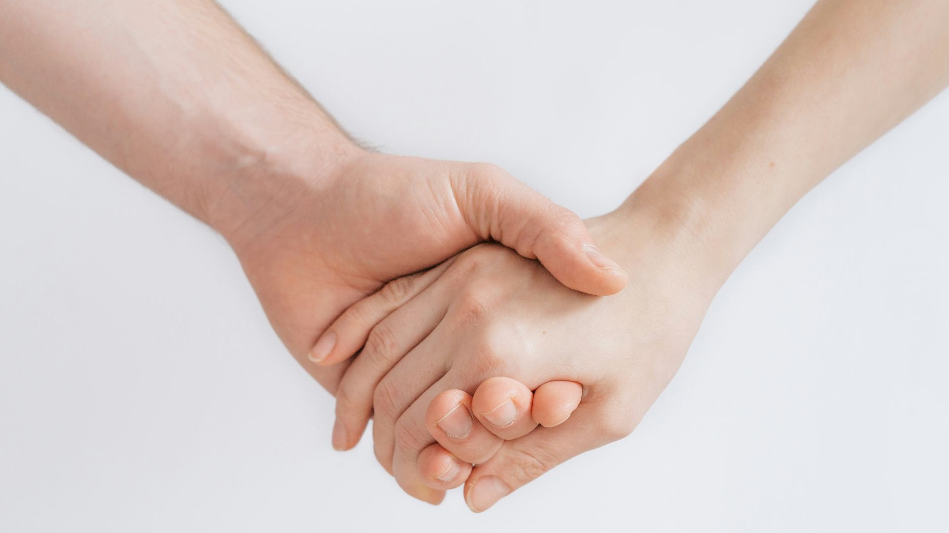 woman and man holding hands