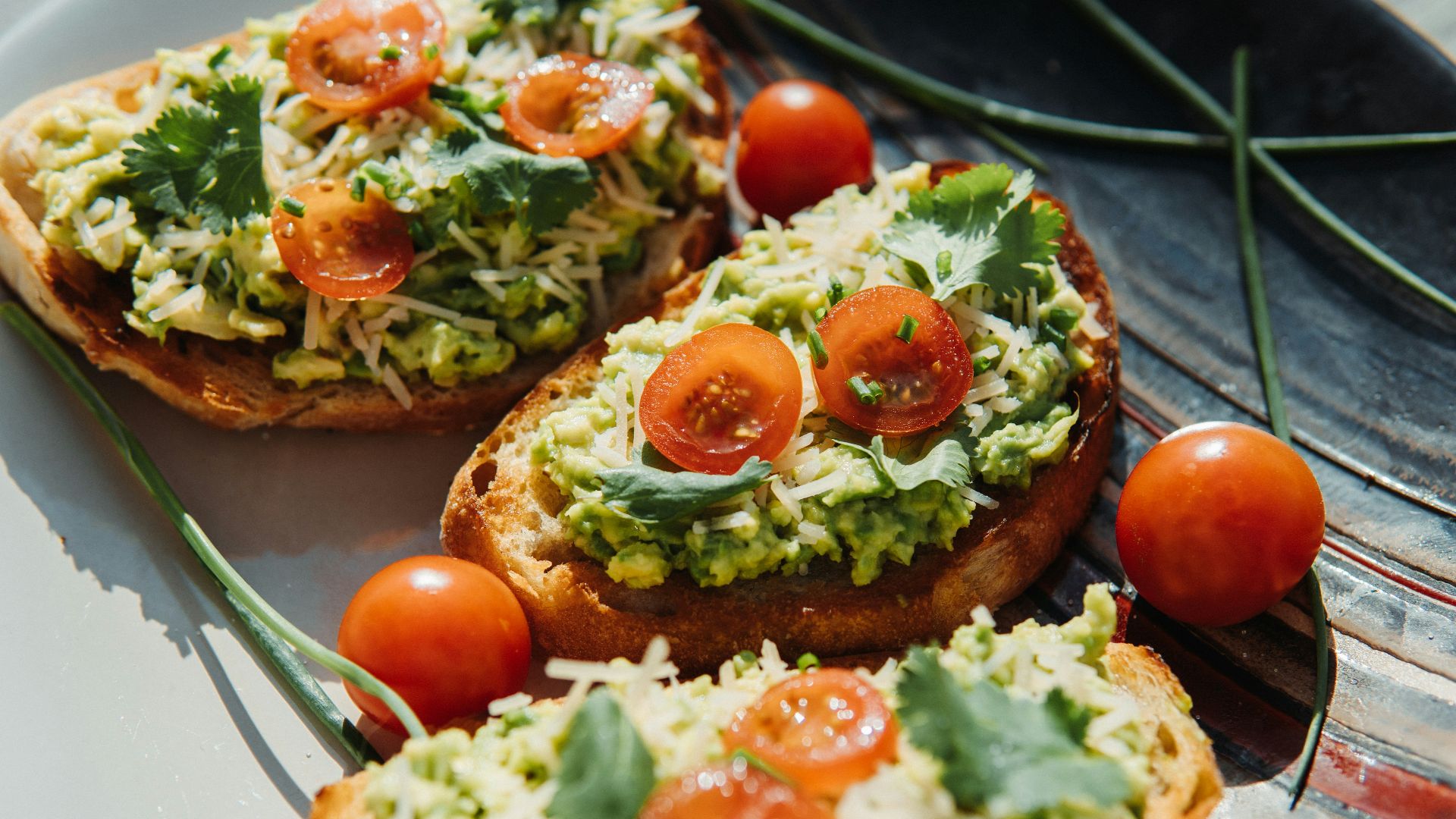 a white plate topped with bread topped with veggies