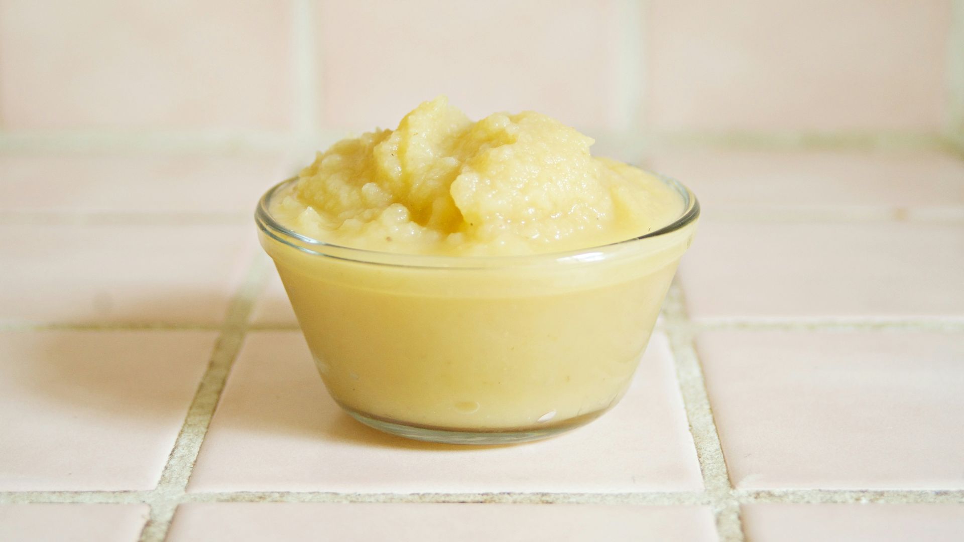 yellow cream in clear glass bowl