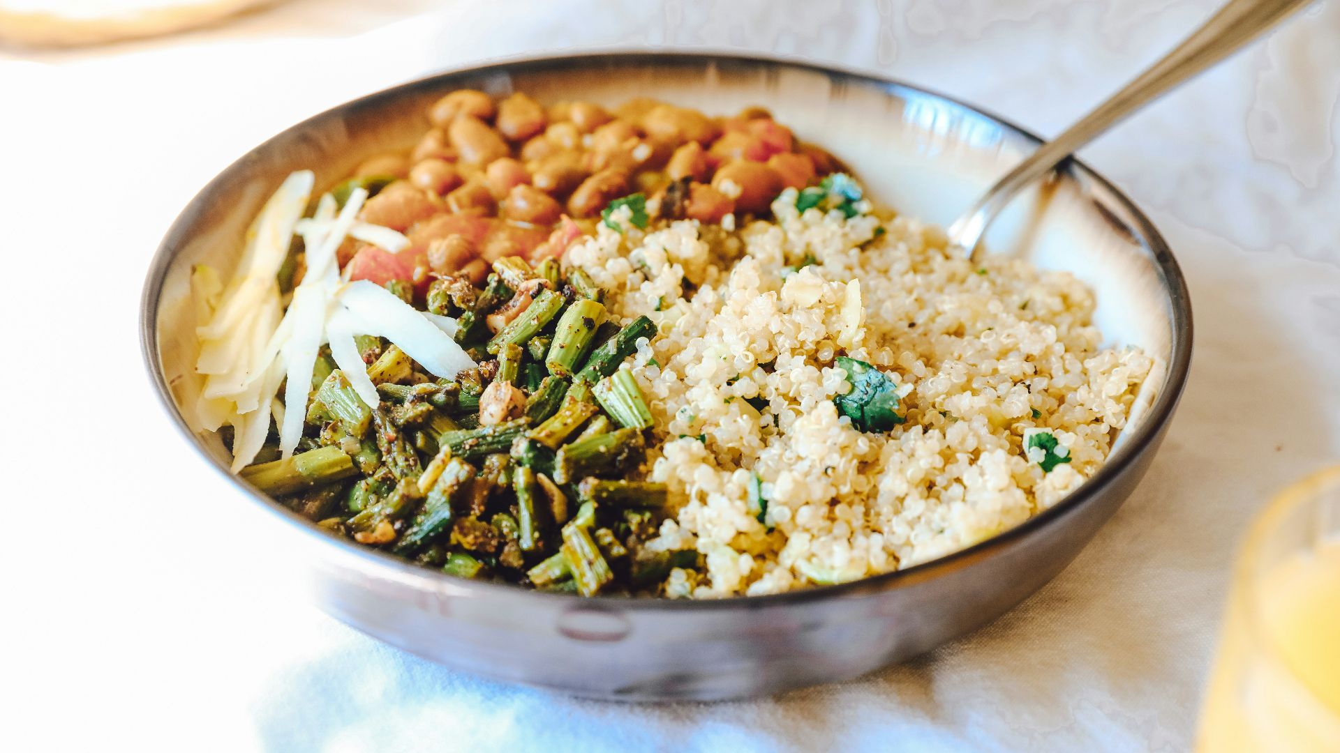 cooked rice with green peas and carrots on stainless steel bowl