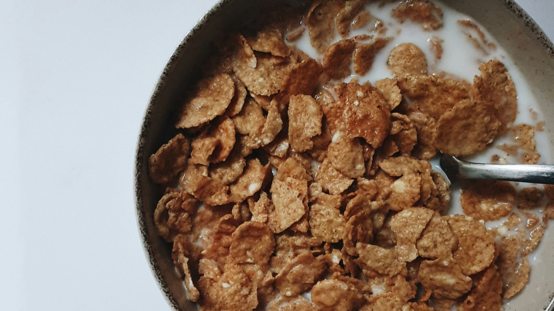 a bowl of cereal with a spoon in it