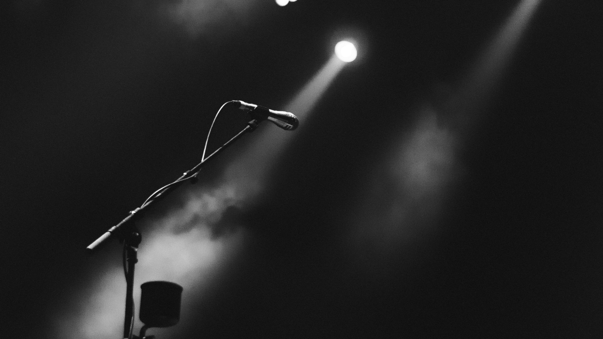 photo of microphone on foggy stage