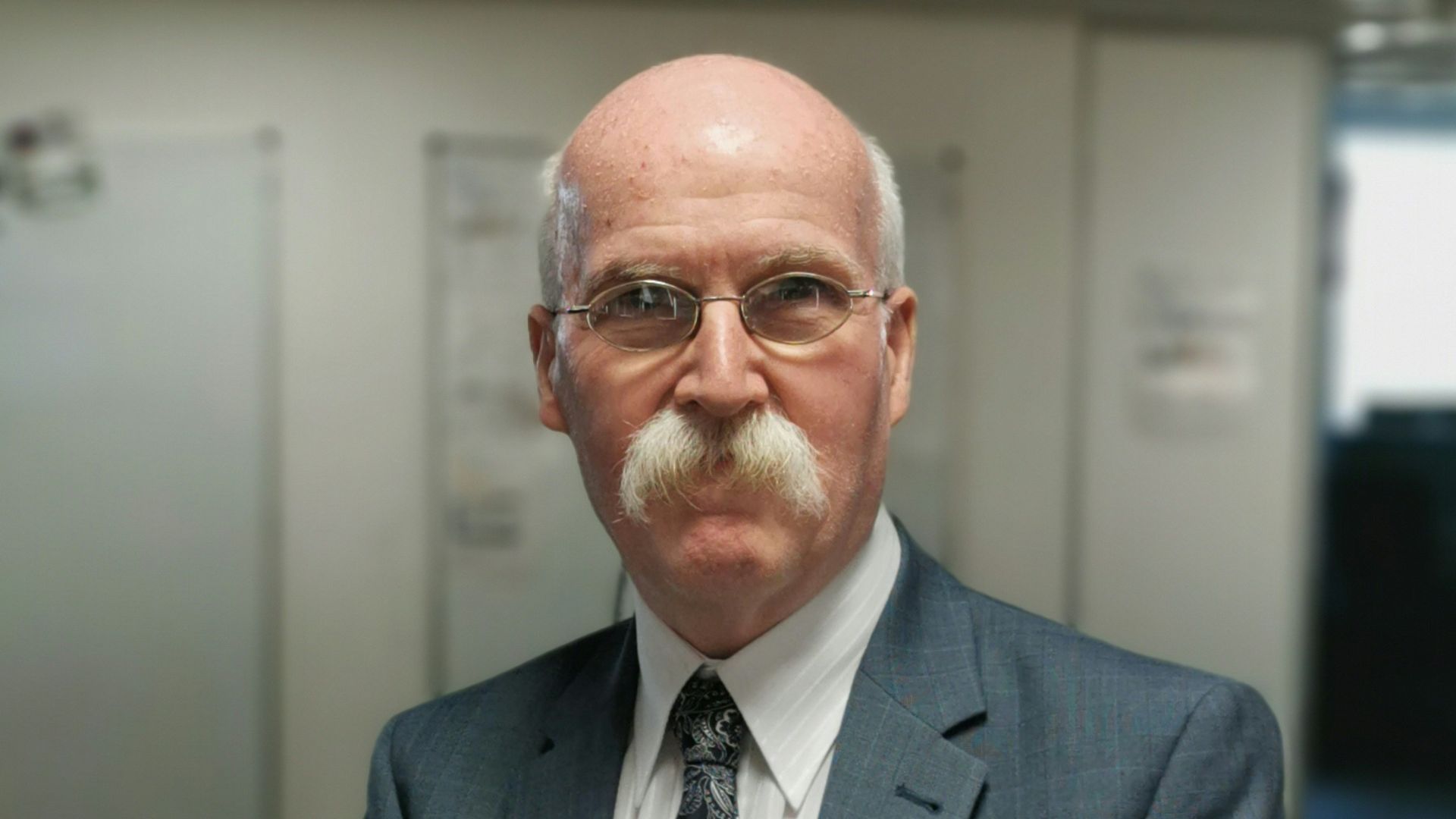 man wearing gray suit jacket