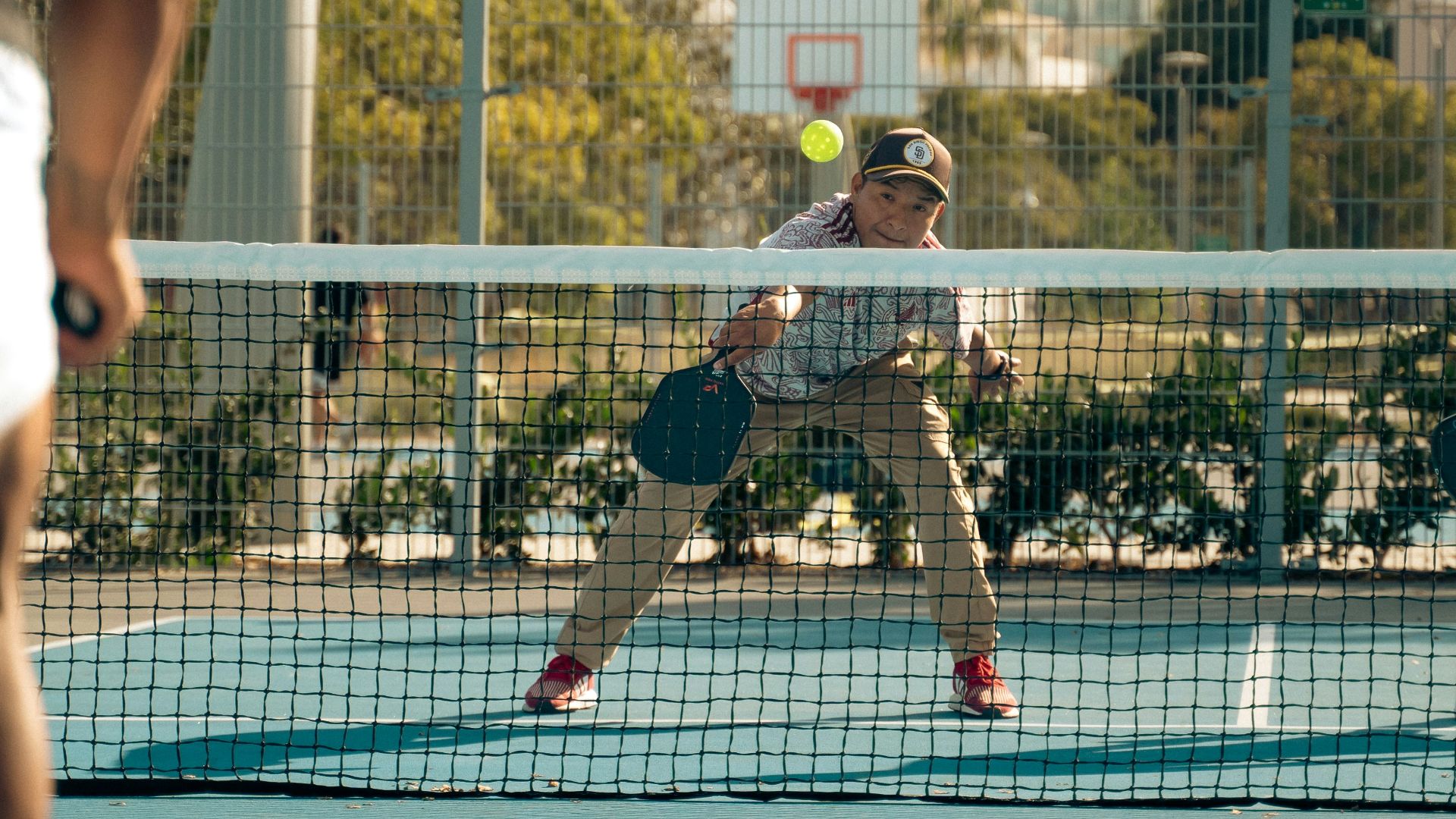 A group of men playing a game of tennis