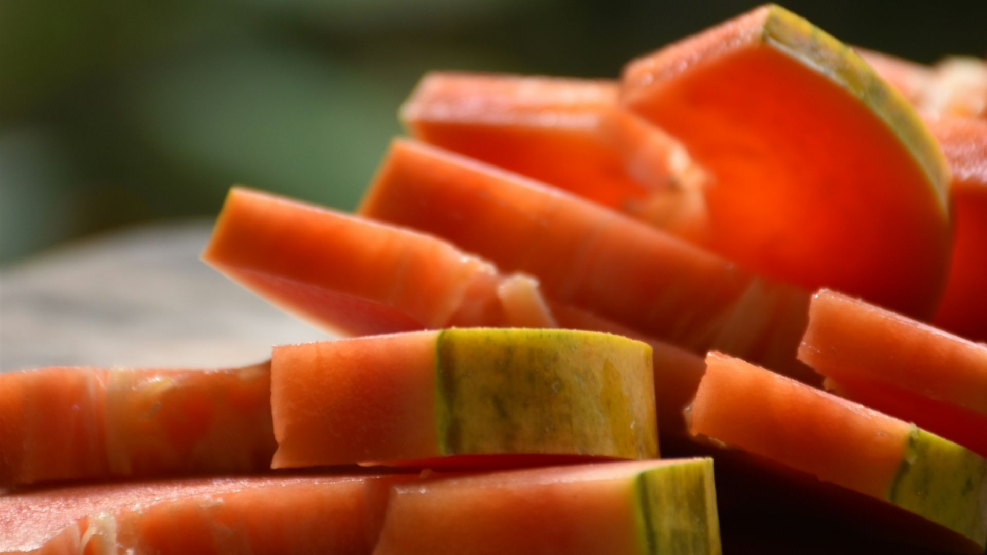 a cutting board topped with sliced up vegetables