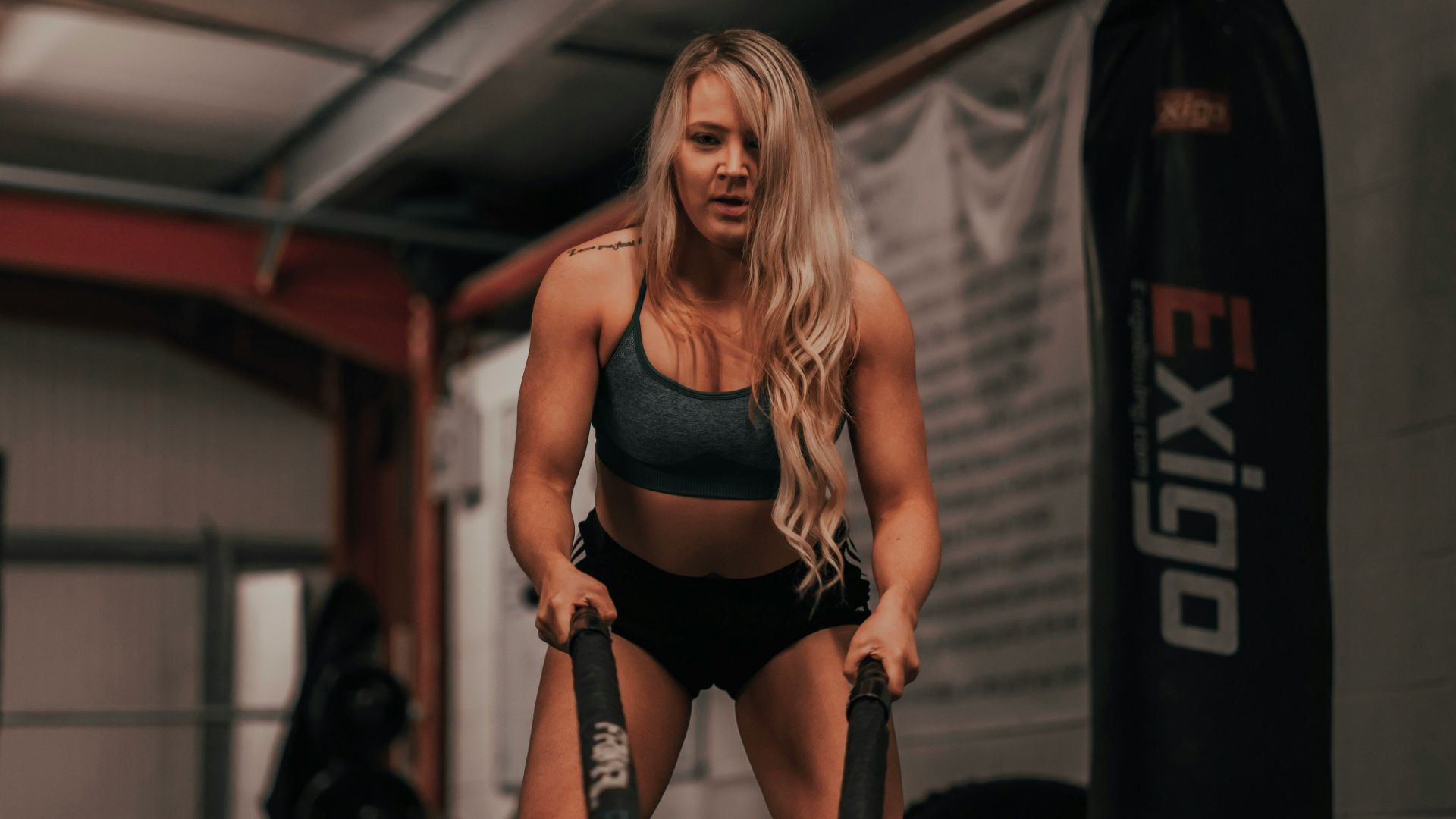 woman in black sports bra and black shorts