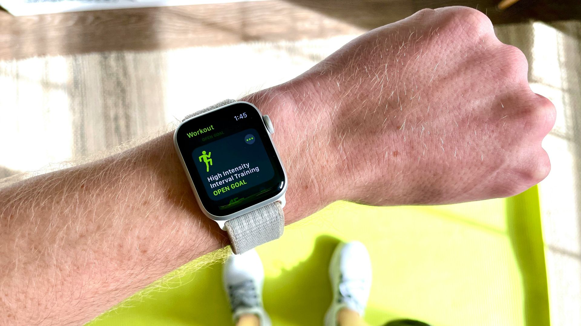 silver aluminum case apple watch with white sport band