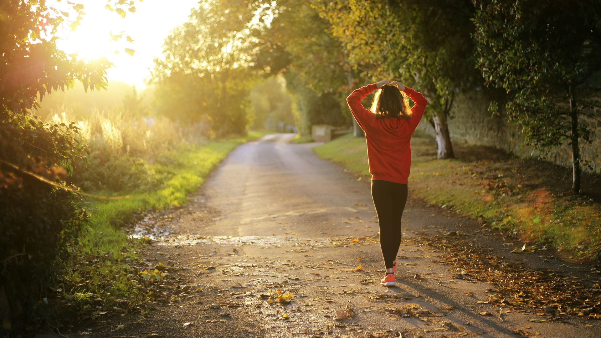 woman walking on pathway during daytime