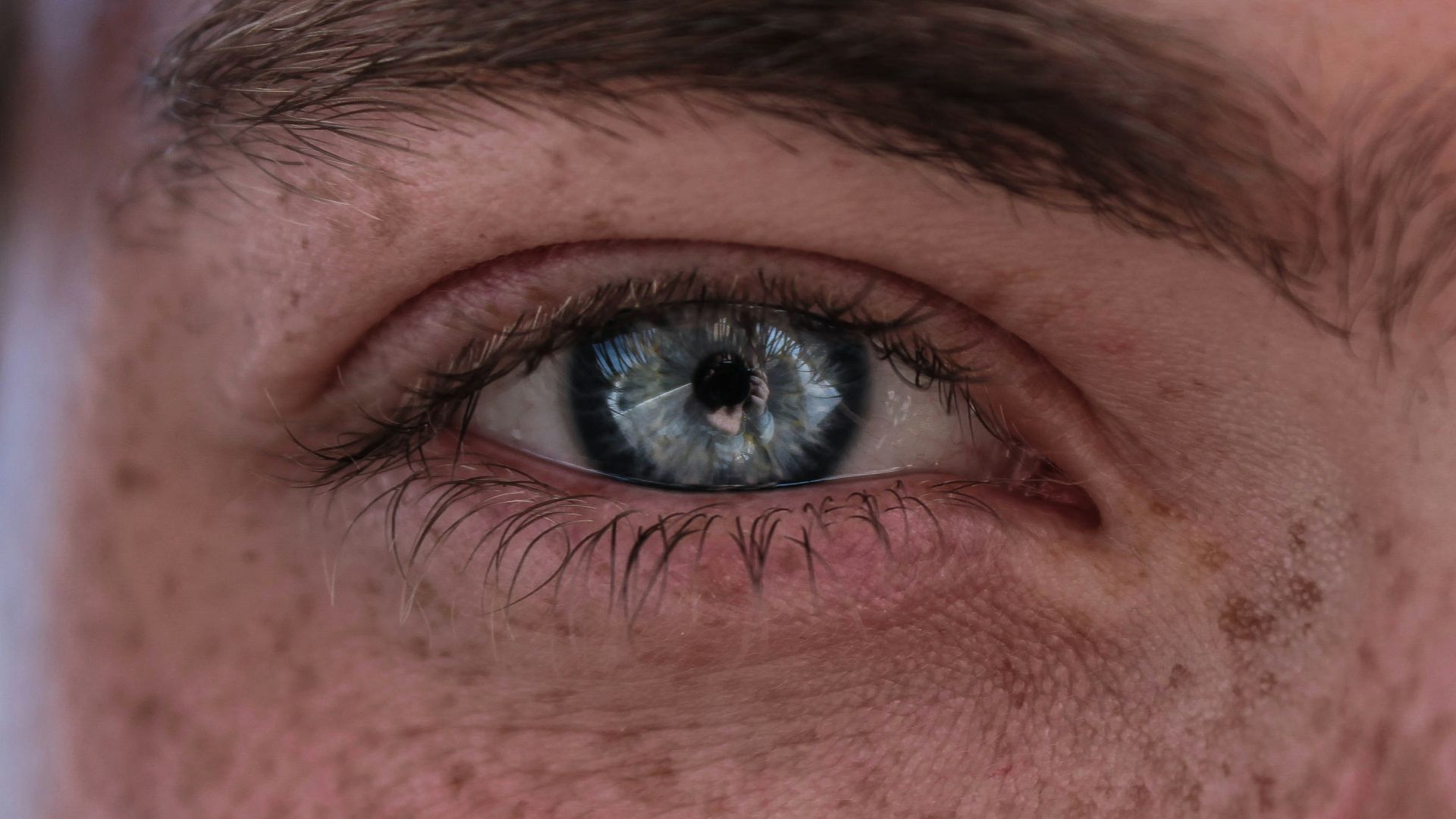 persons eye in close up photography