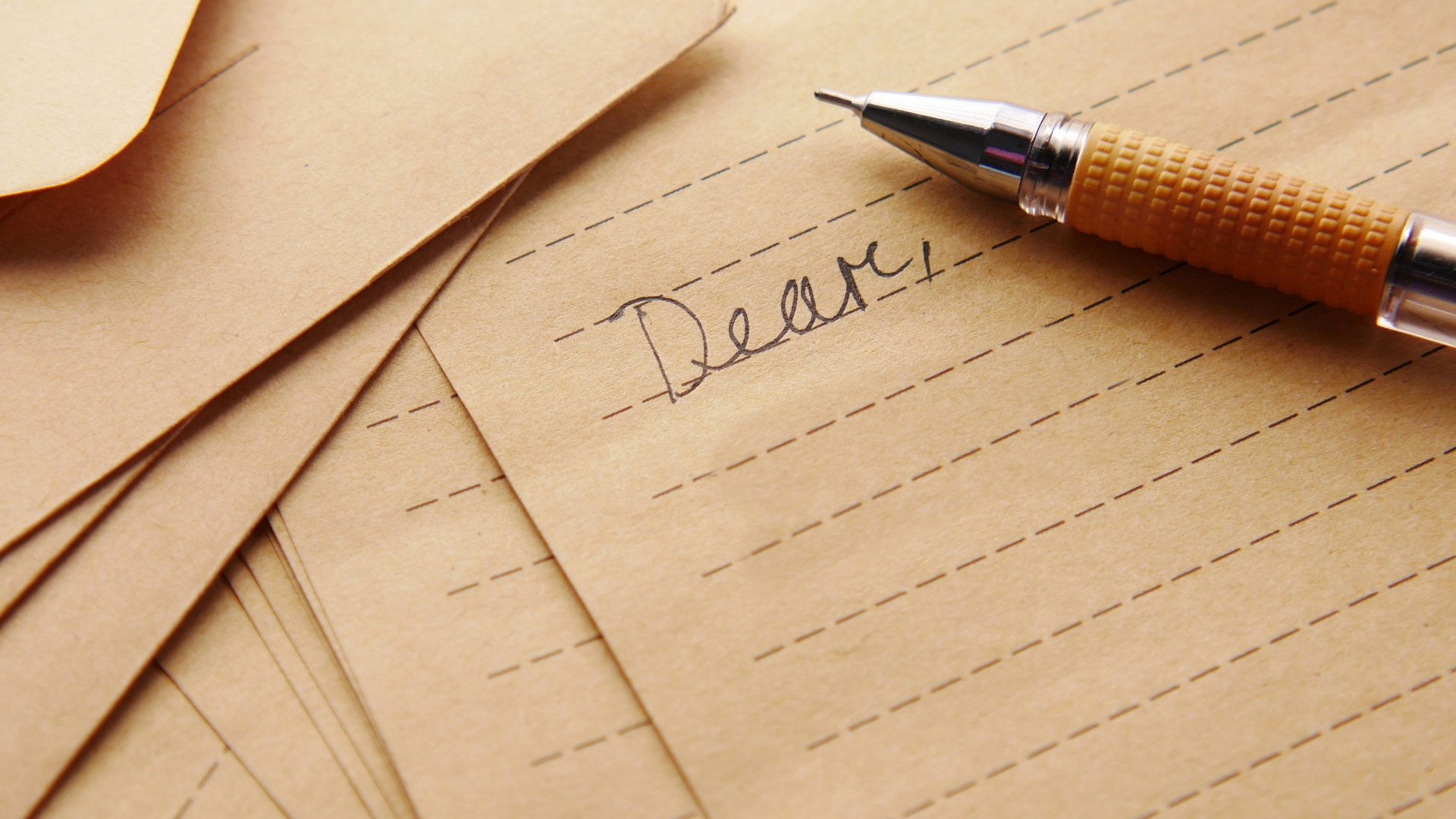 a pen sitting on top of a piece of paper