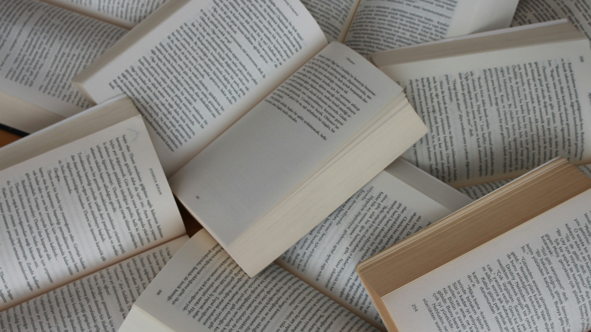 white and brown book on brown woven surface