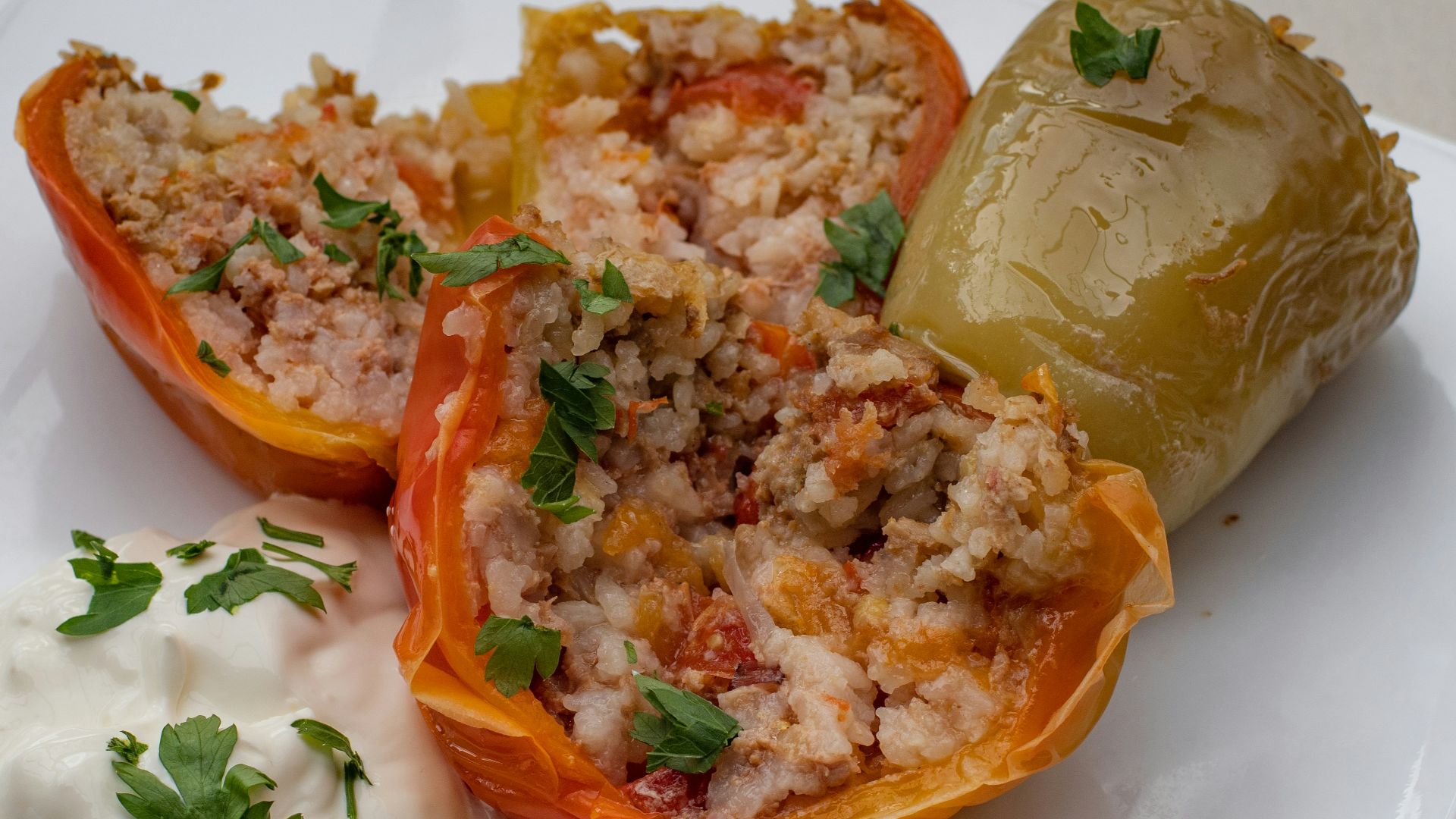 a white plate topped with stuffed bell peppers
