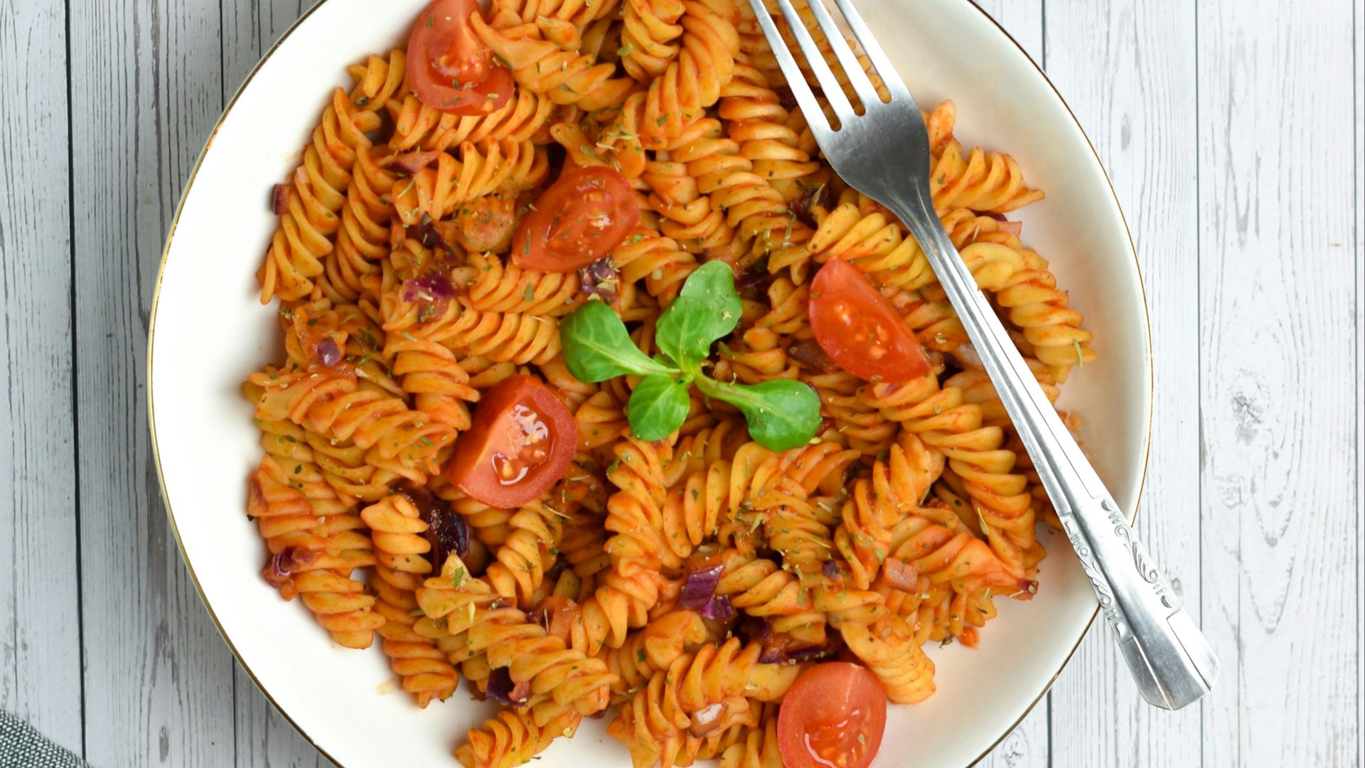 pasta with sauce on white ceramic plate