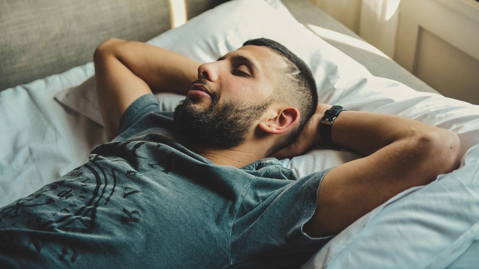 man lying on bed