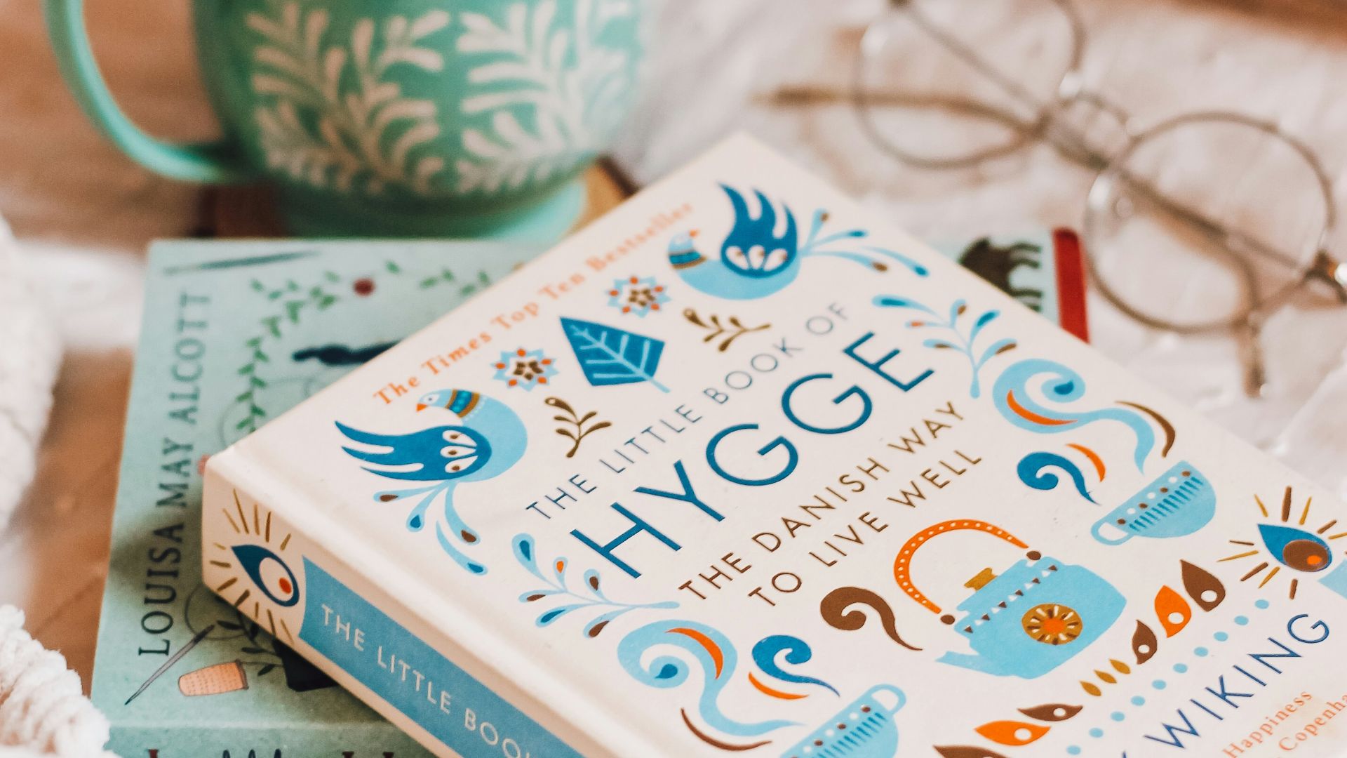 white and blue book on white textile