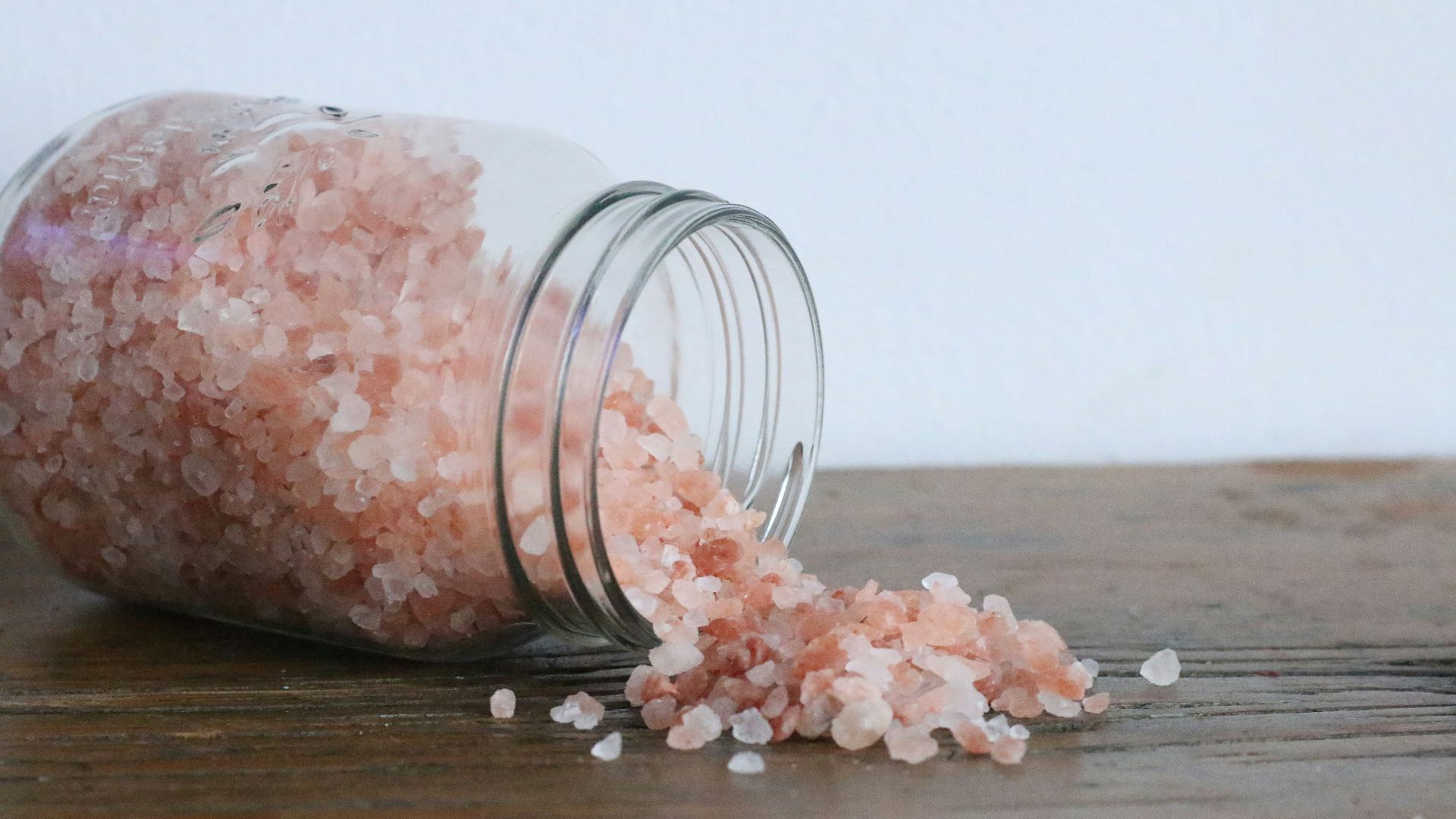 white and brown stones in clear glass jar