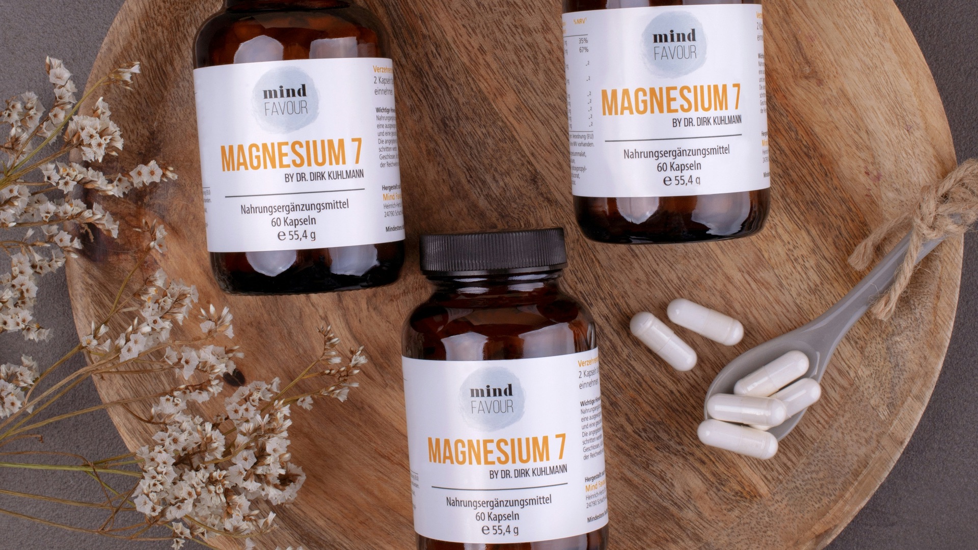 three bottles of magnesum on a wooden plate