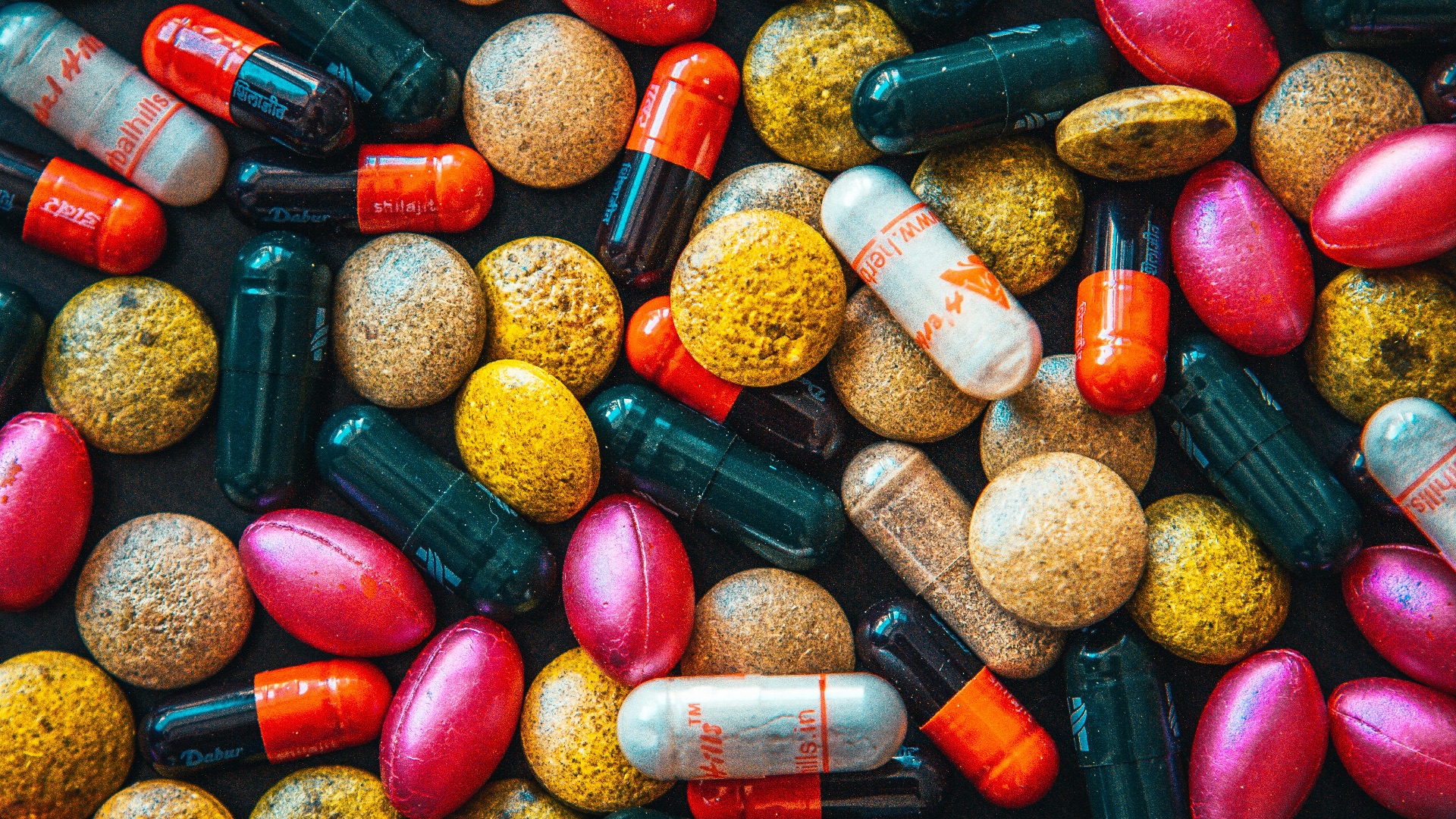 red and brown medication pill