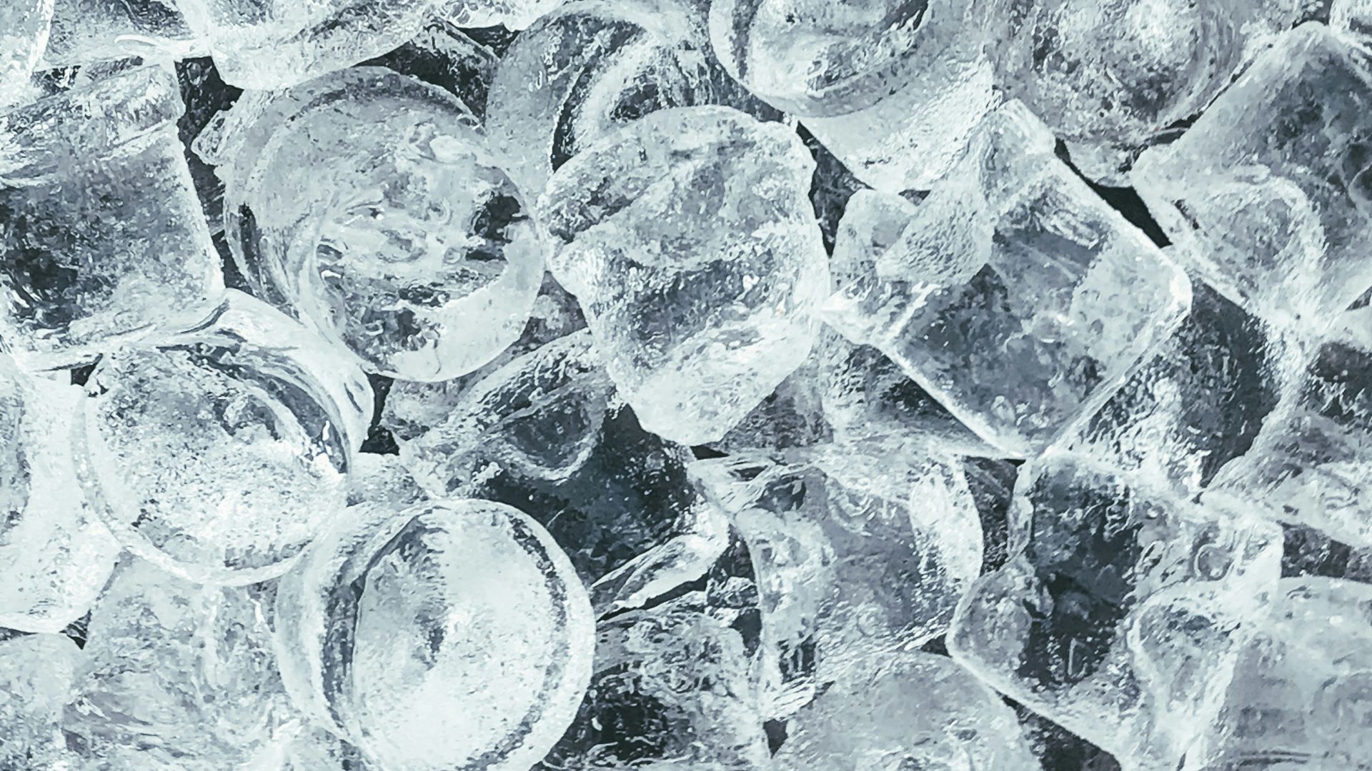 clear glass round ornament on gray stone