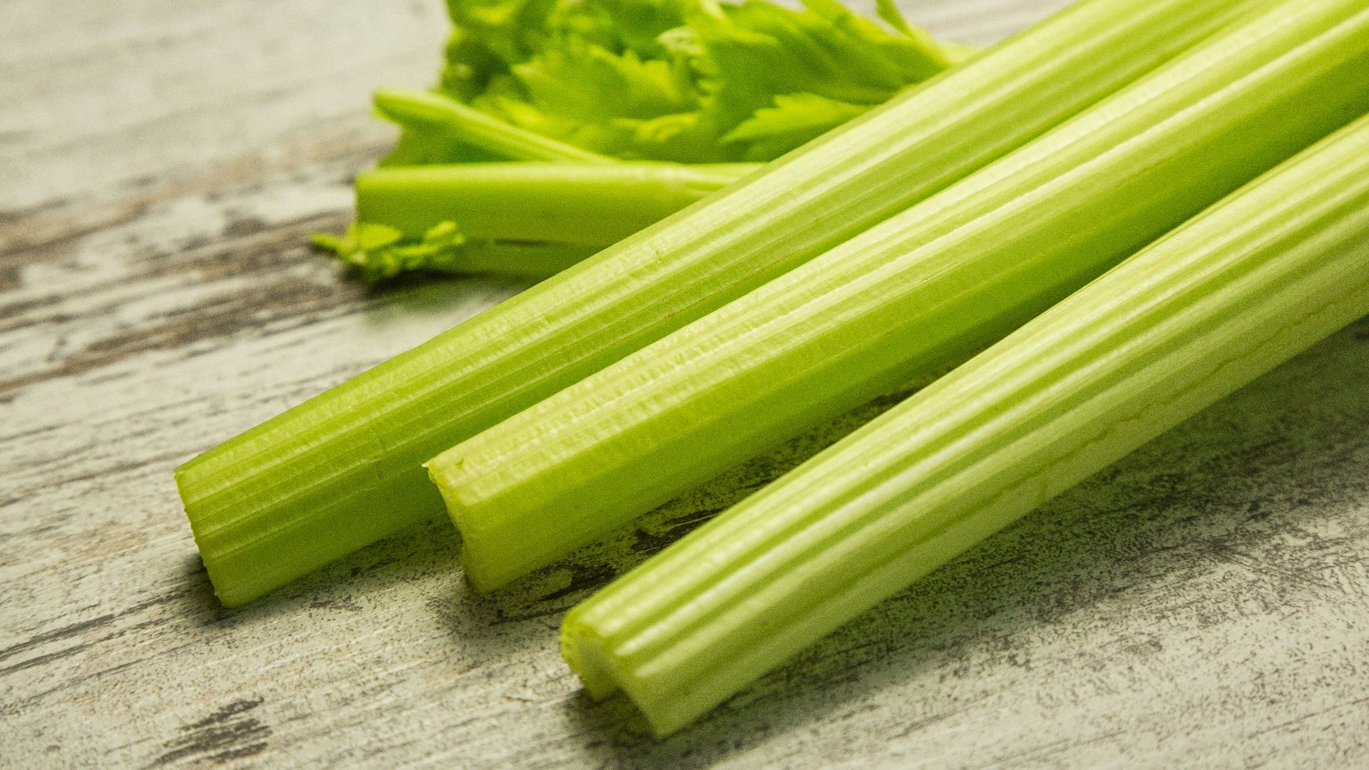 green vegetable on gray wooden table