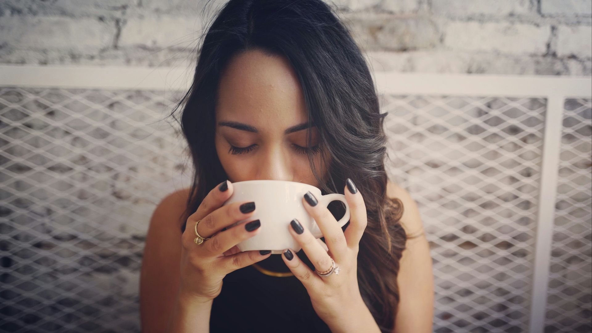 woman drinking with cup