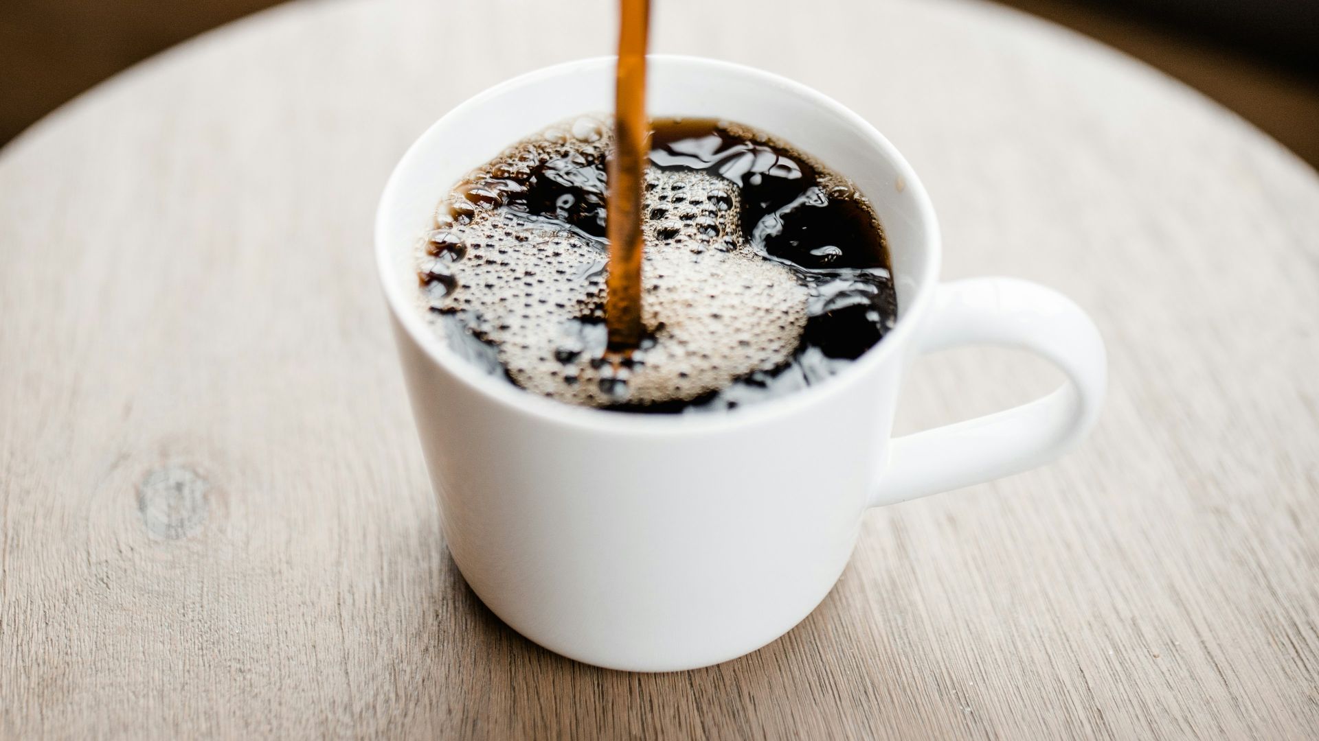 white ceramic mug with coffee