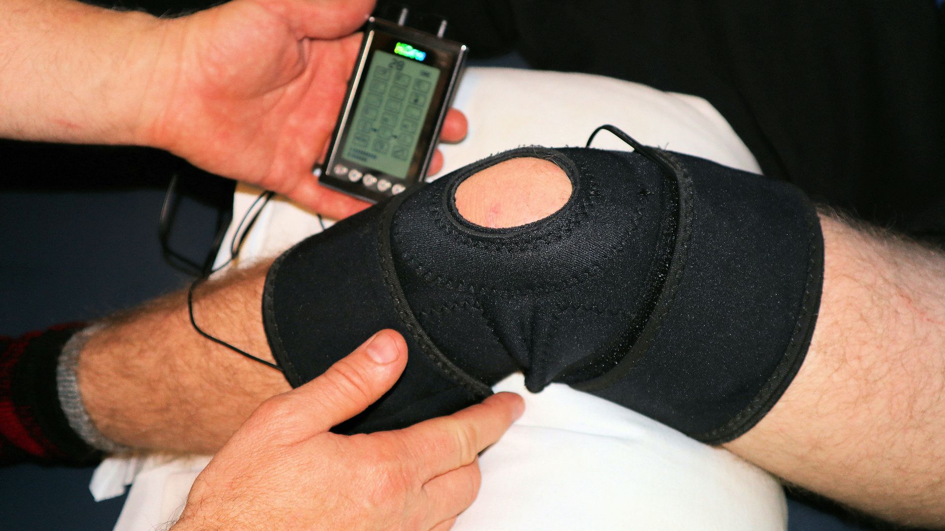 person holding black knit cap