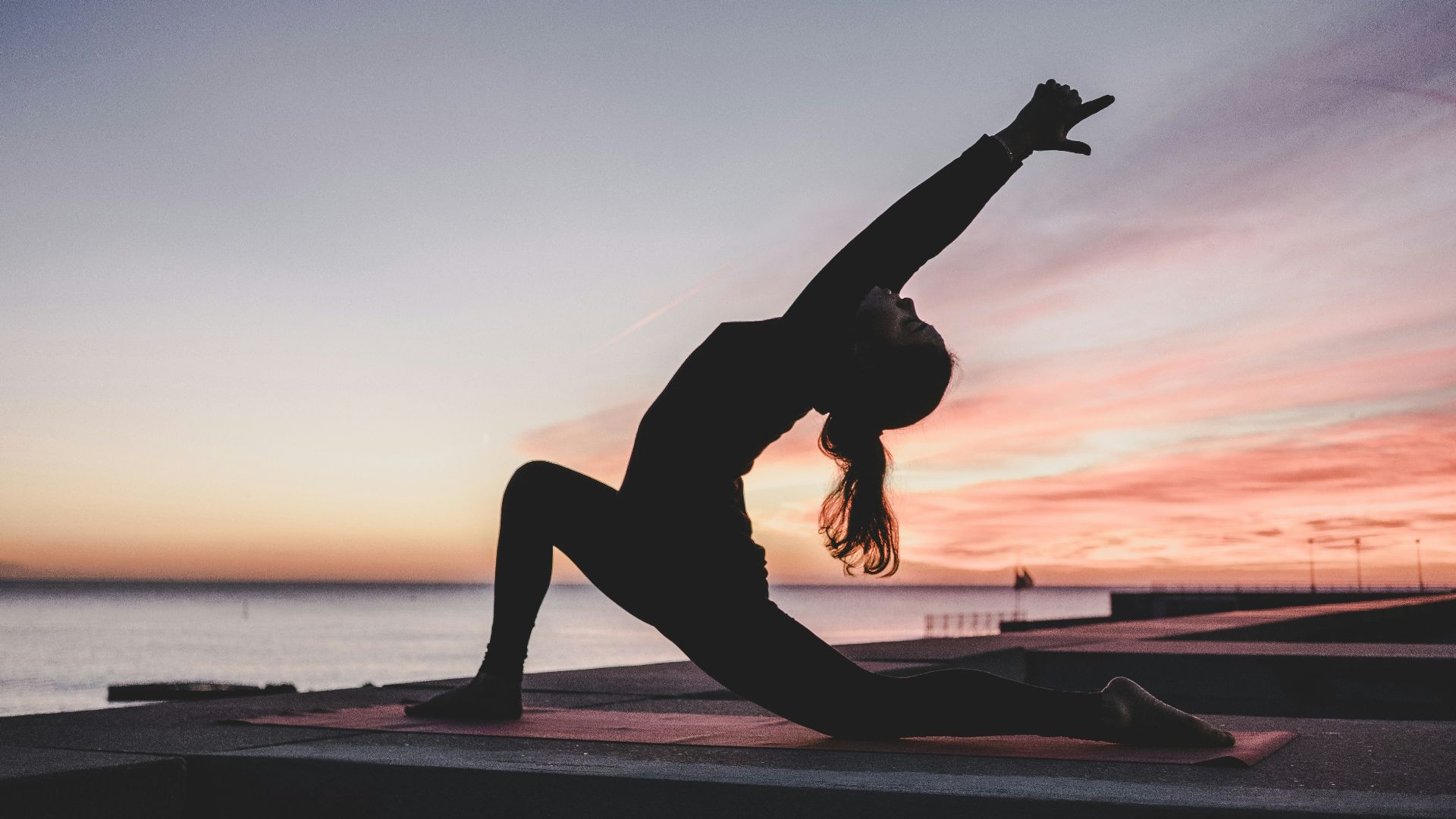 silhouette photography of woman doing yoga