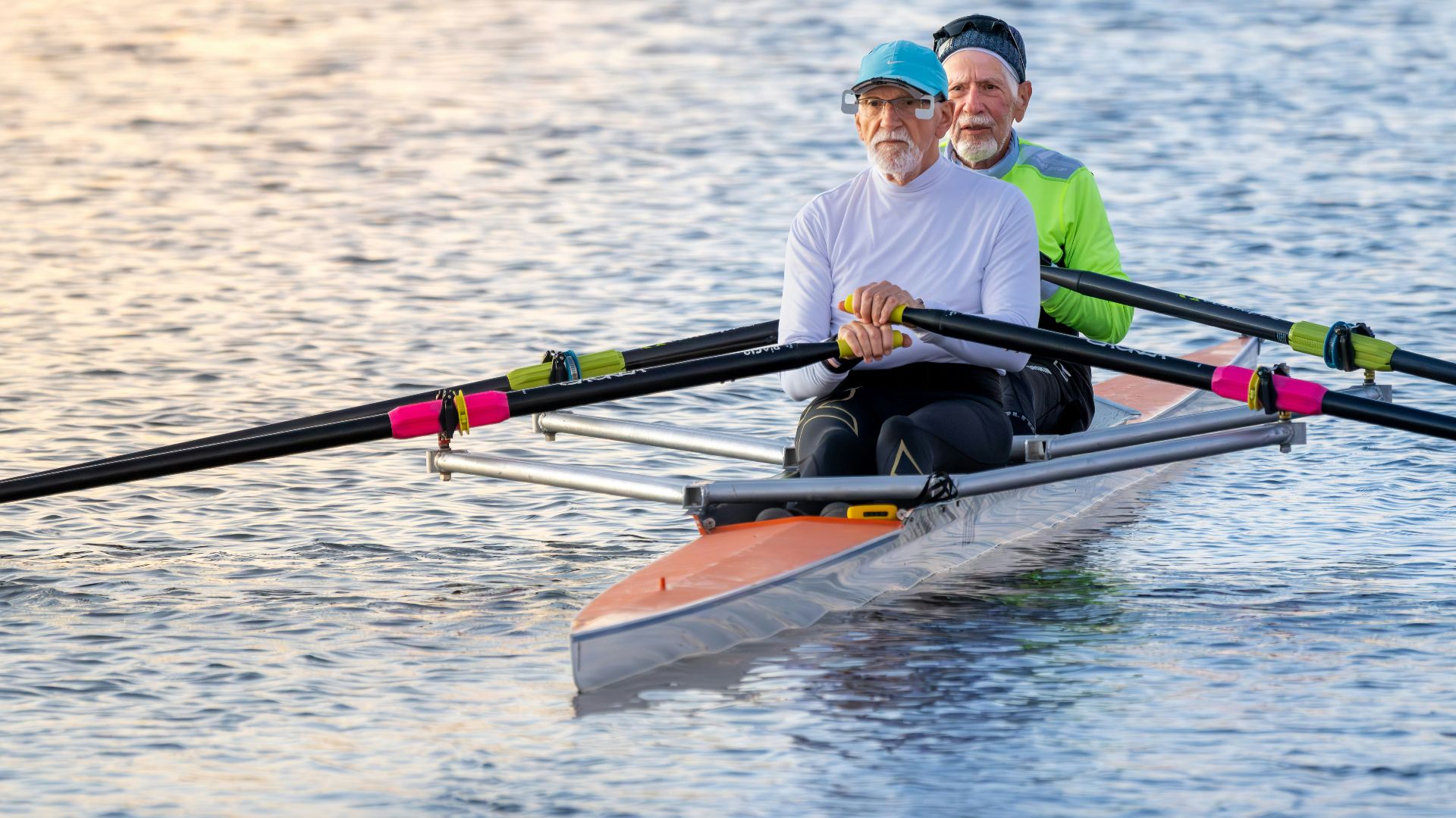 Two people rowing a boat.