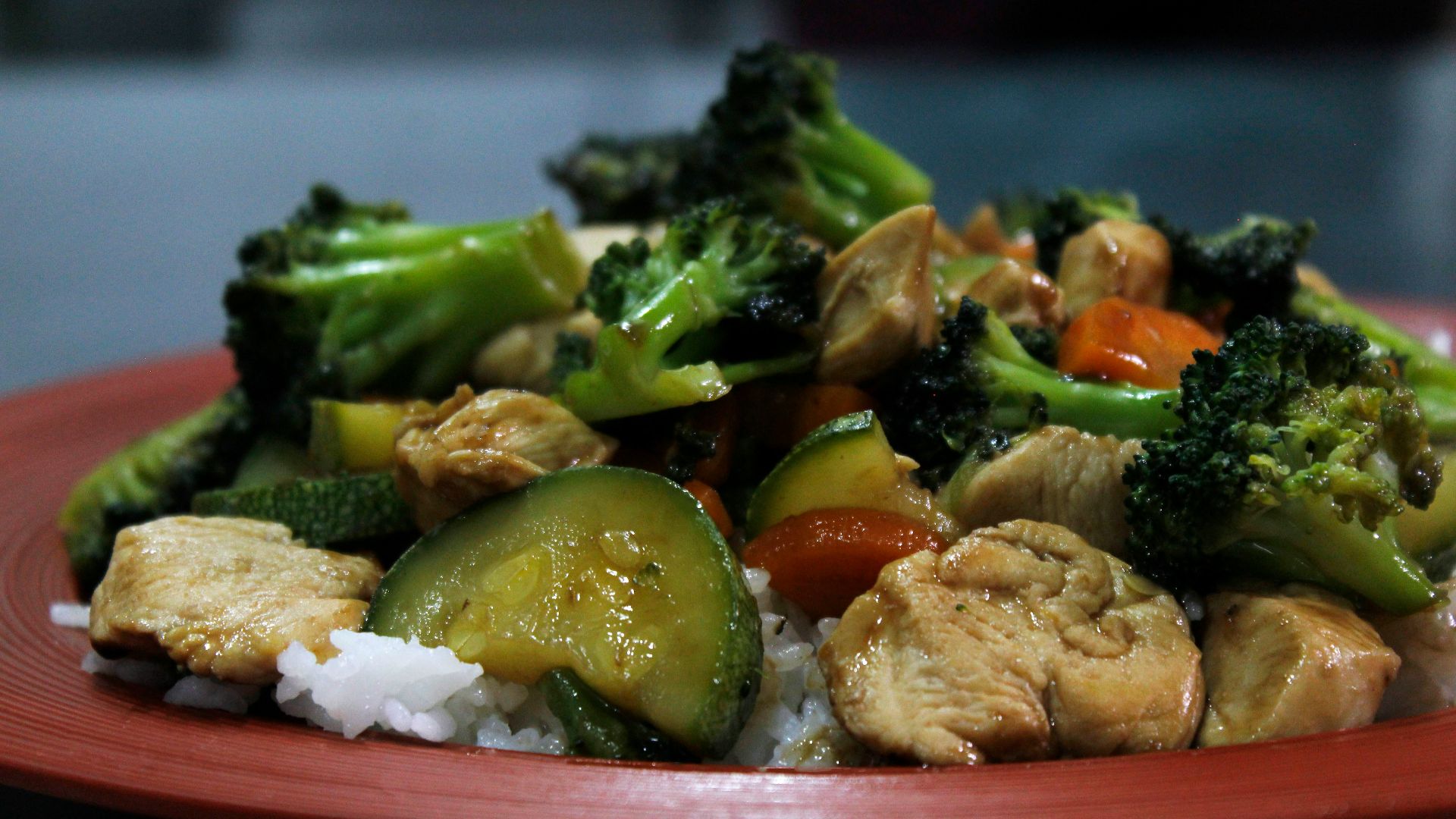 cooked food on red ceramic plate