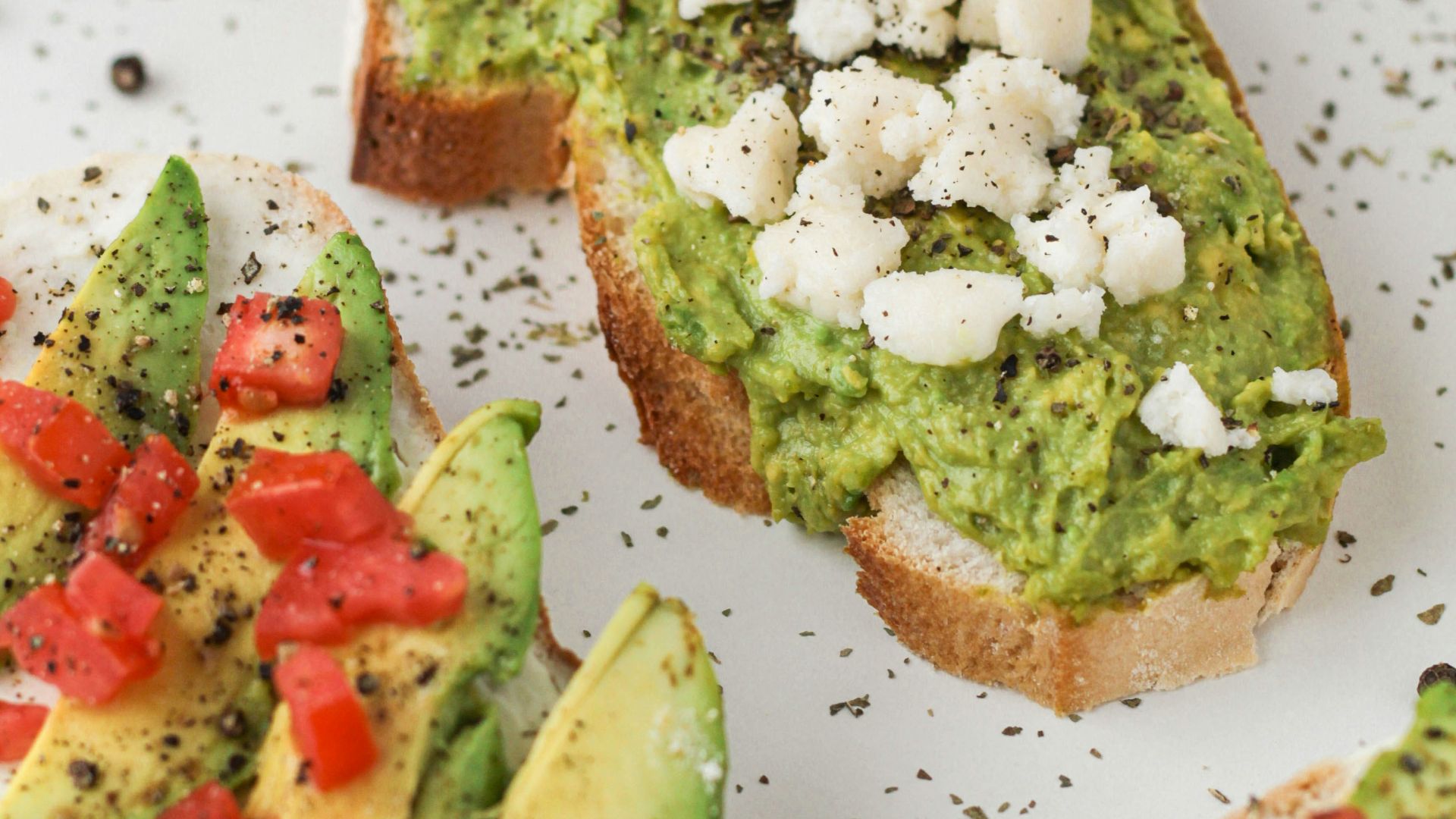 brown bread with green vegetable on white ceramic plate
