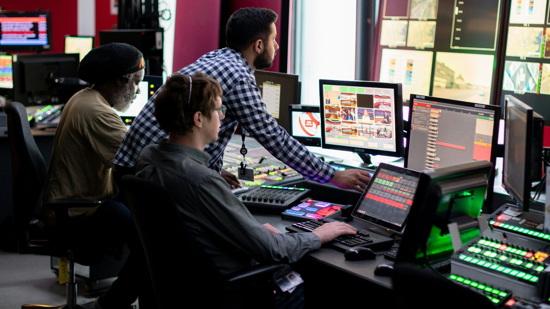 man in black and white checkered dress shirt sitting on black office rolling chair