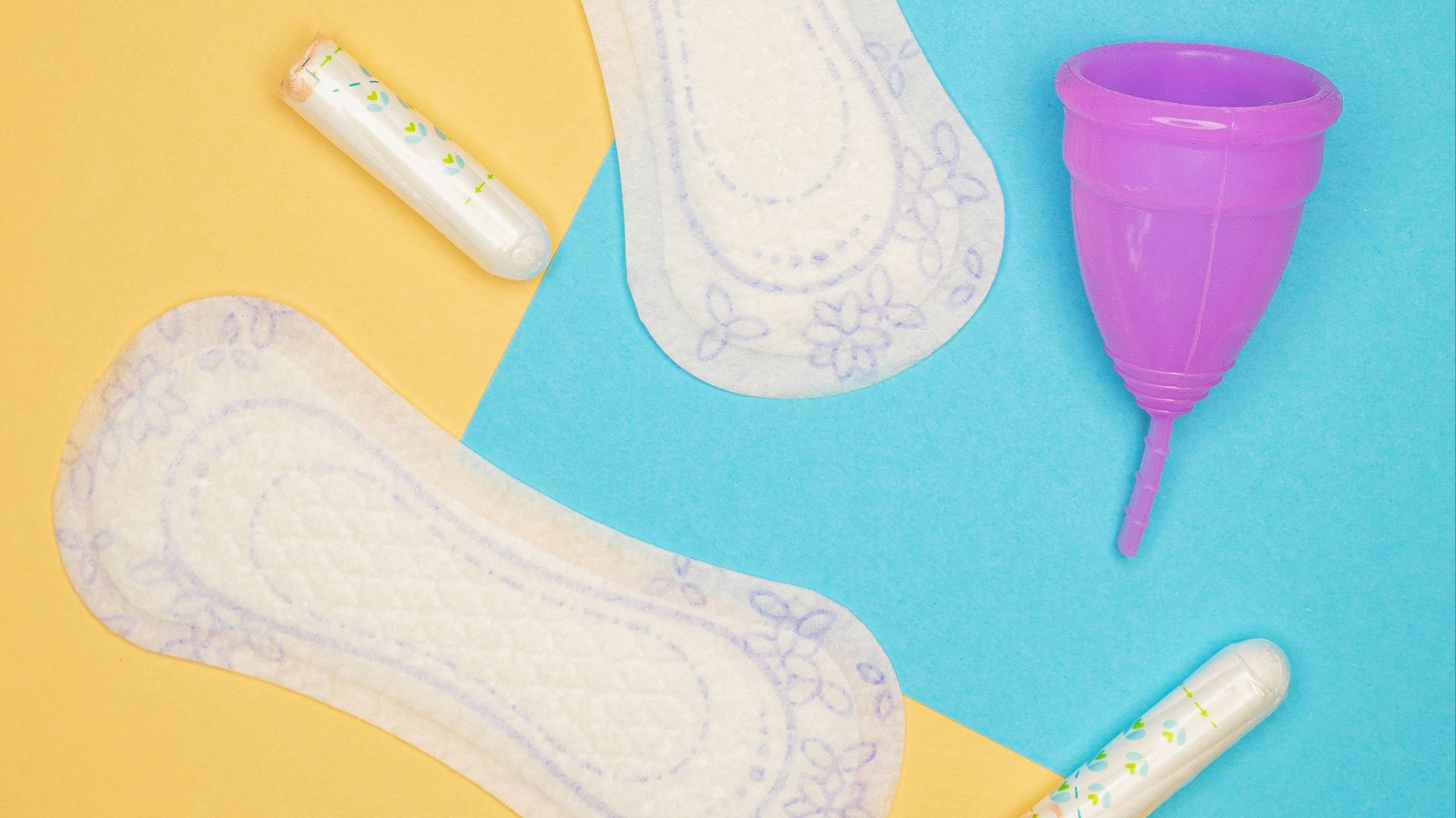 a pair of white socks and a purple cup on a blue and yellow background