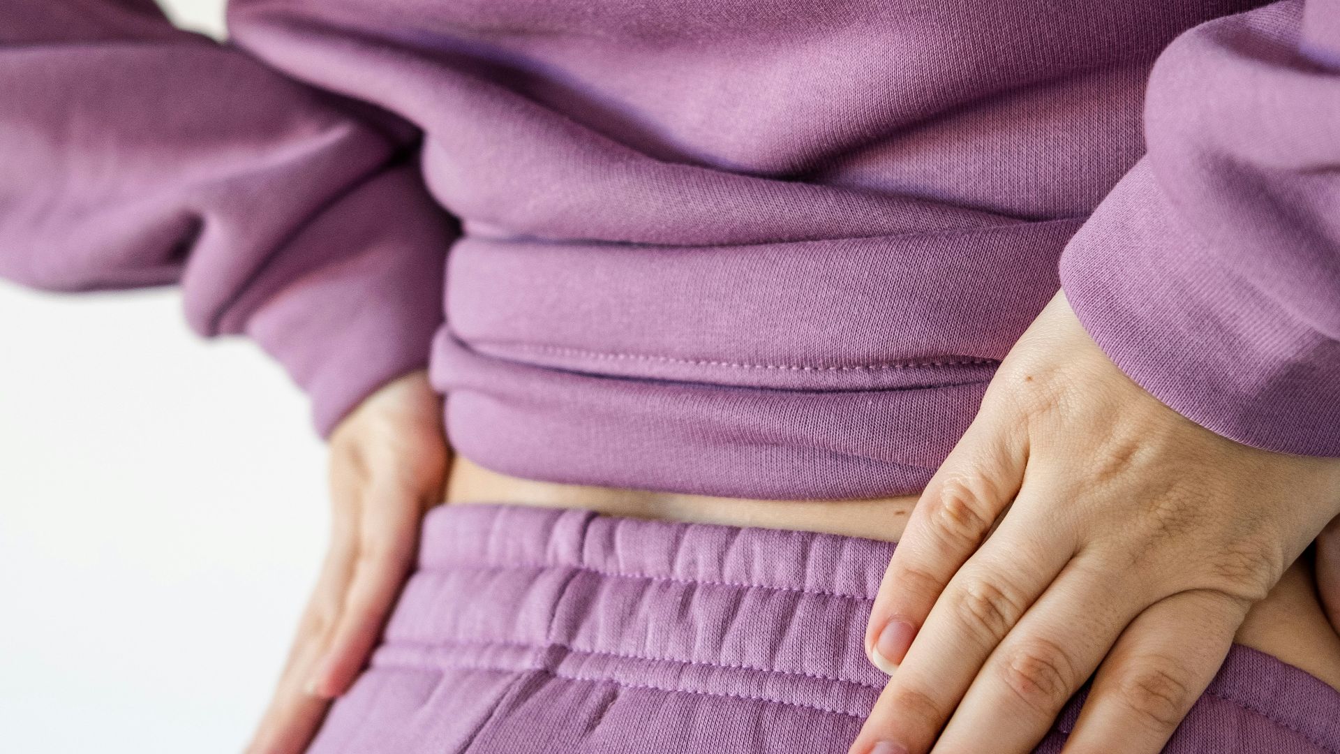 a person with their hands on their hips