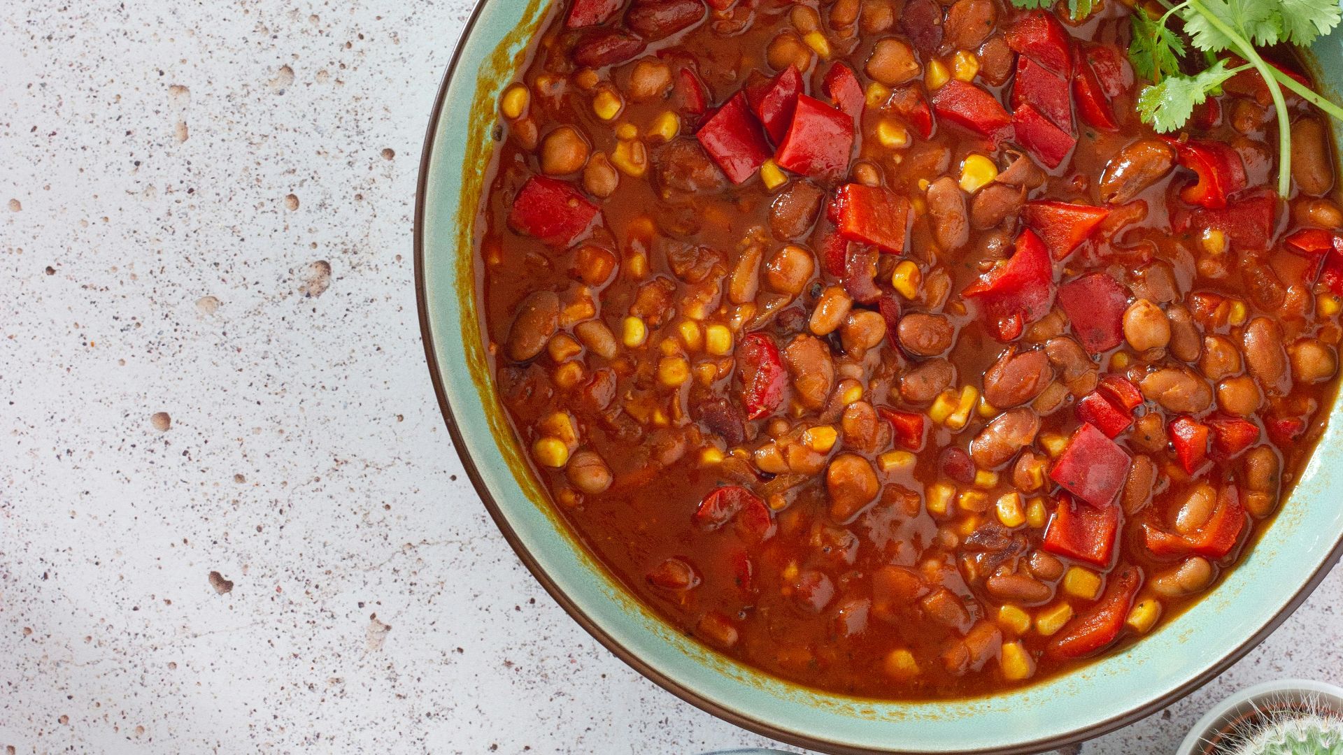 red and green chili peppers in white ceramic bowl