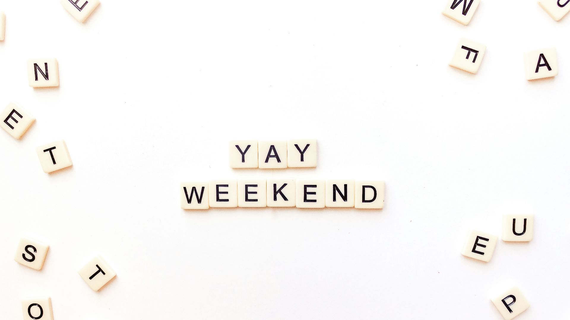scrabble letters spelling out the word yay weekend