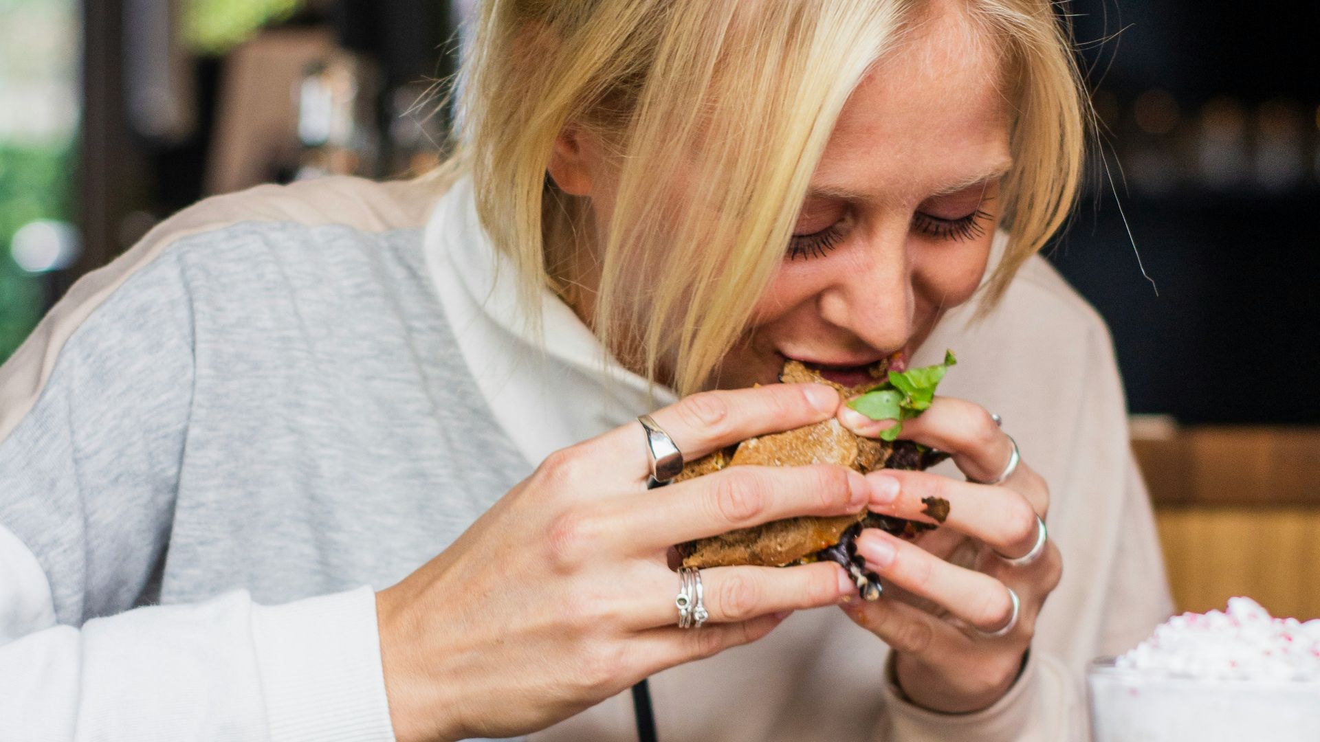 woman eating burger