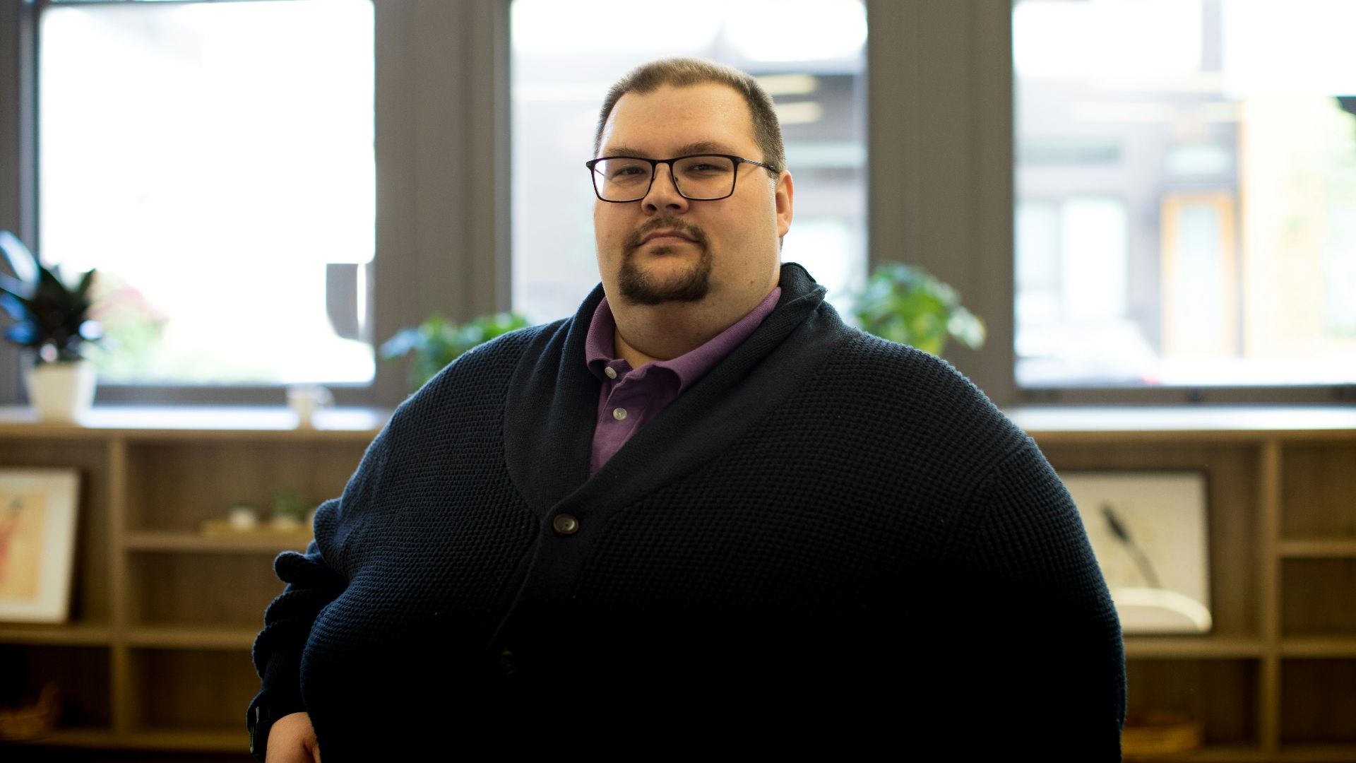 man in black cardigan