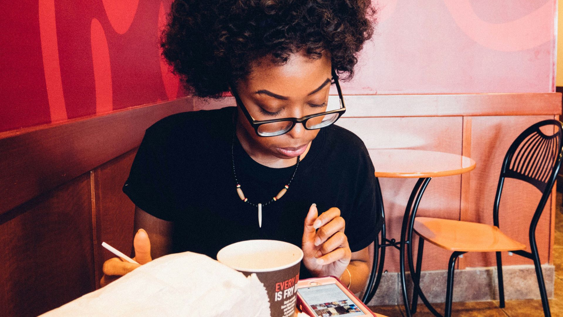 woman in black long sleeve shirt sitting on chair